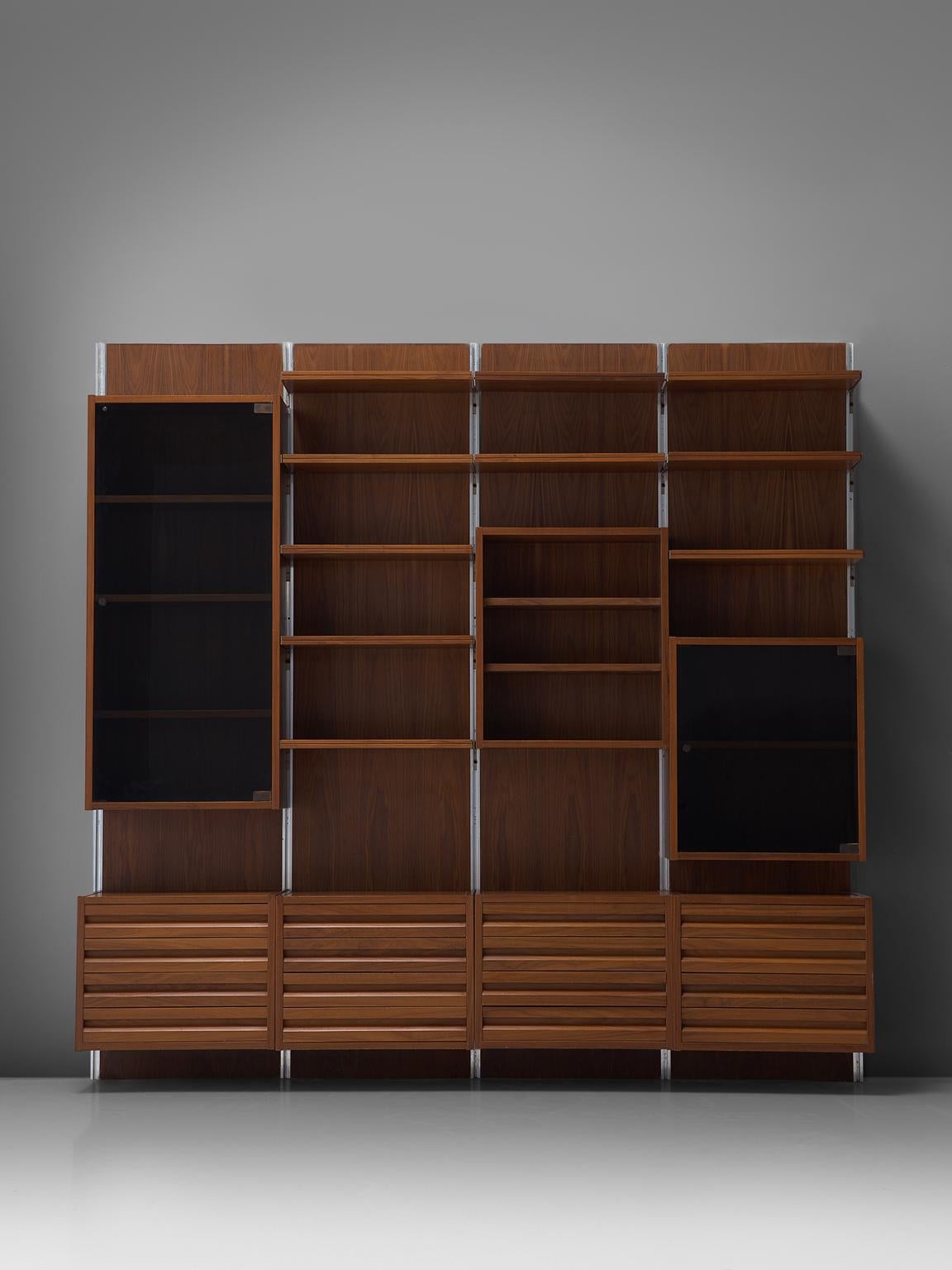 Wall unit, walnut, glass, polished steel, Italy, 1960s

This wall-mounted shelving unit is four sections large, with a width of 2.8 metres. This system shows characteristics of the wall units of Borsani for Tecno, and therefore attributed to them.