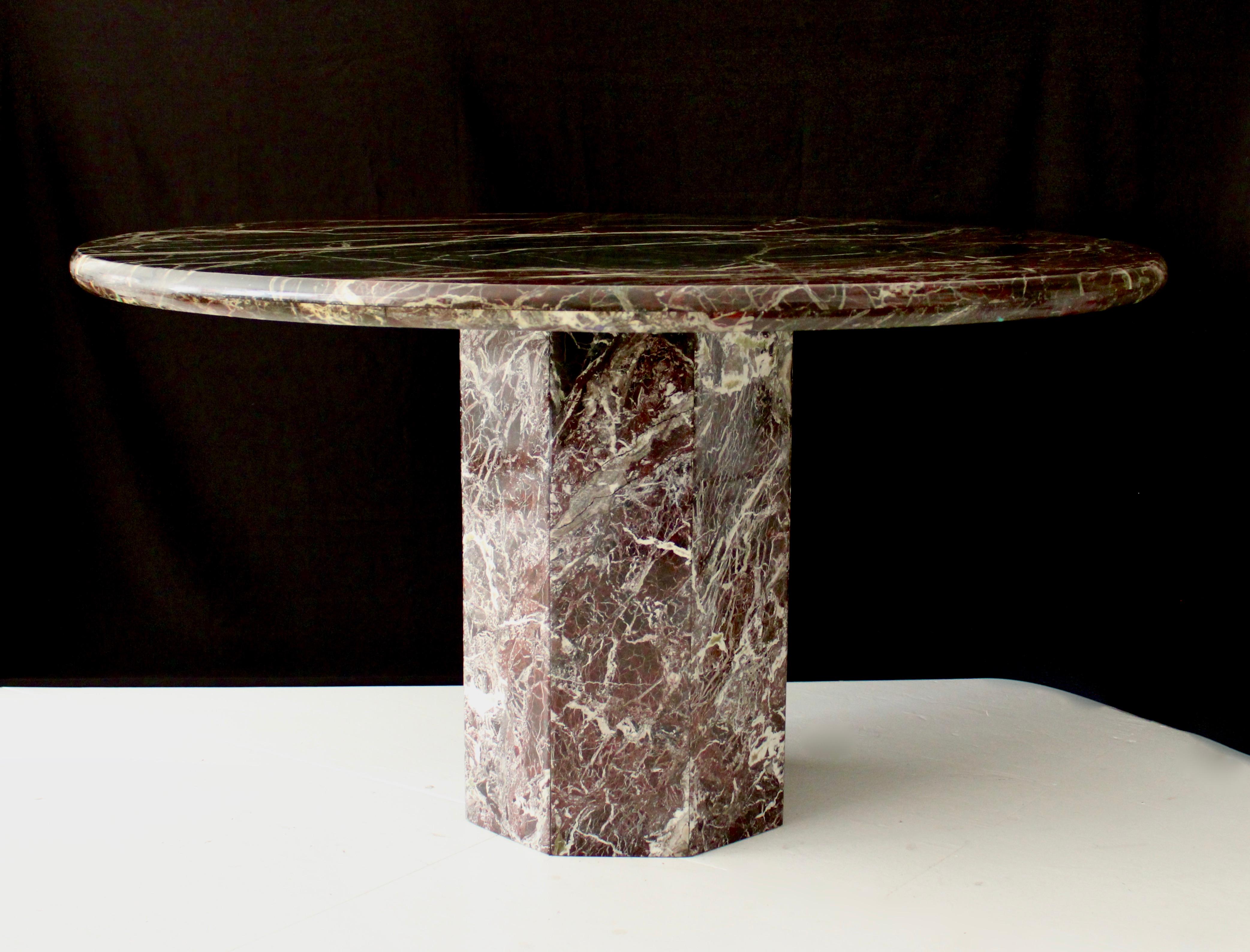 Rosso Levanto round Italian marble dining or center table on an octagonal or 8 faceted base.
Wonderful veining with alternating being of white and deep reds on this table with no chips or restorations.
Overall size: 51
