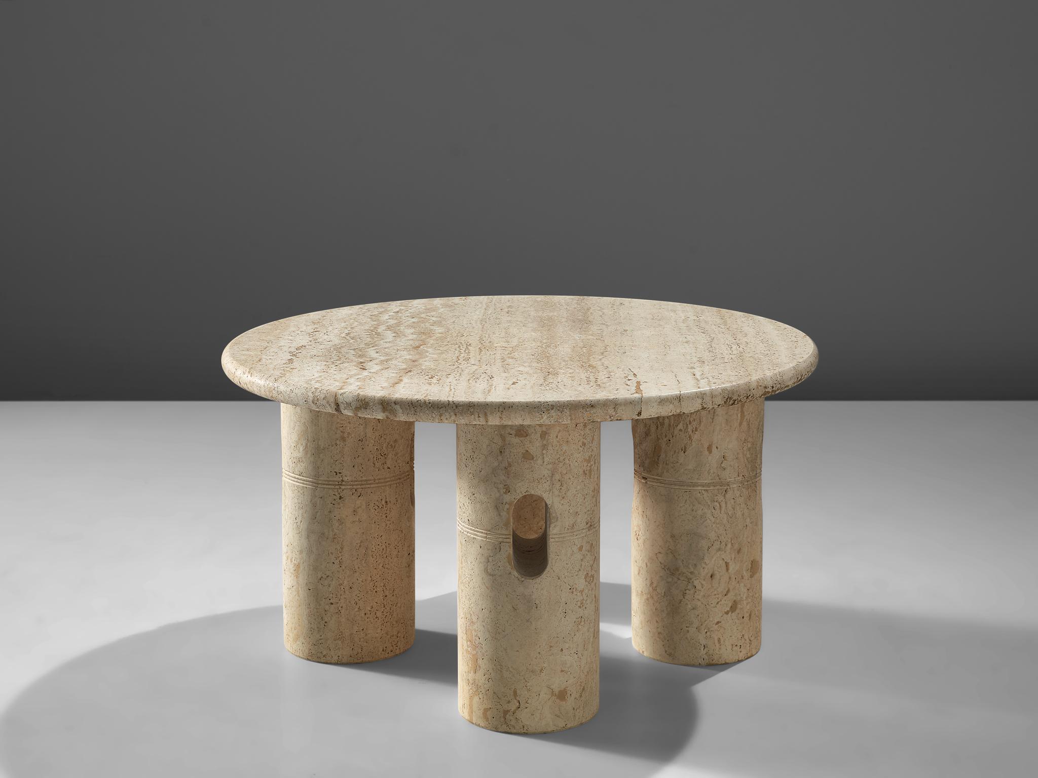 Cocktail table, travertine, Italy, 1970s.

This architectural coffee table is a skilful example of postmodern design. The table rests on the four column-like legs, creating a classical, monumental piece. These tables are archetypical postmodern,