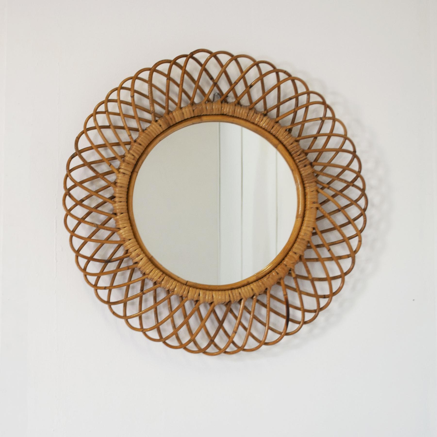 Mid-Century Modern Italian Round mirror with woven wicker (india cane) frame. For Sale