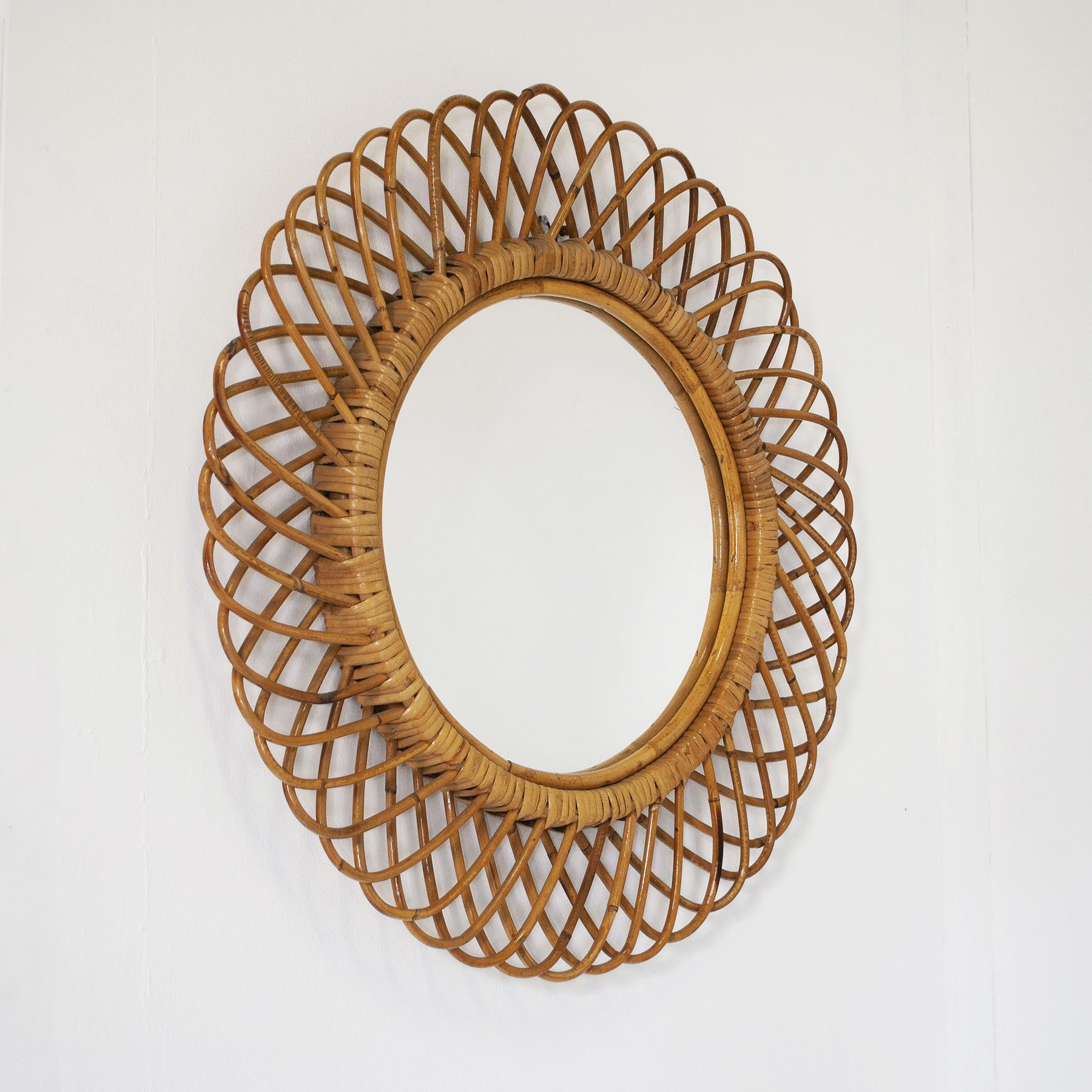 Rattan Italian Round mirror with woven wicker (india cane) frame. For Sale