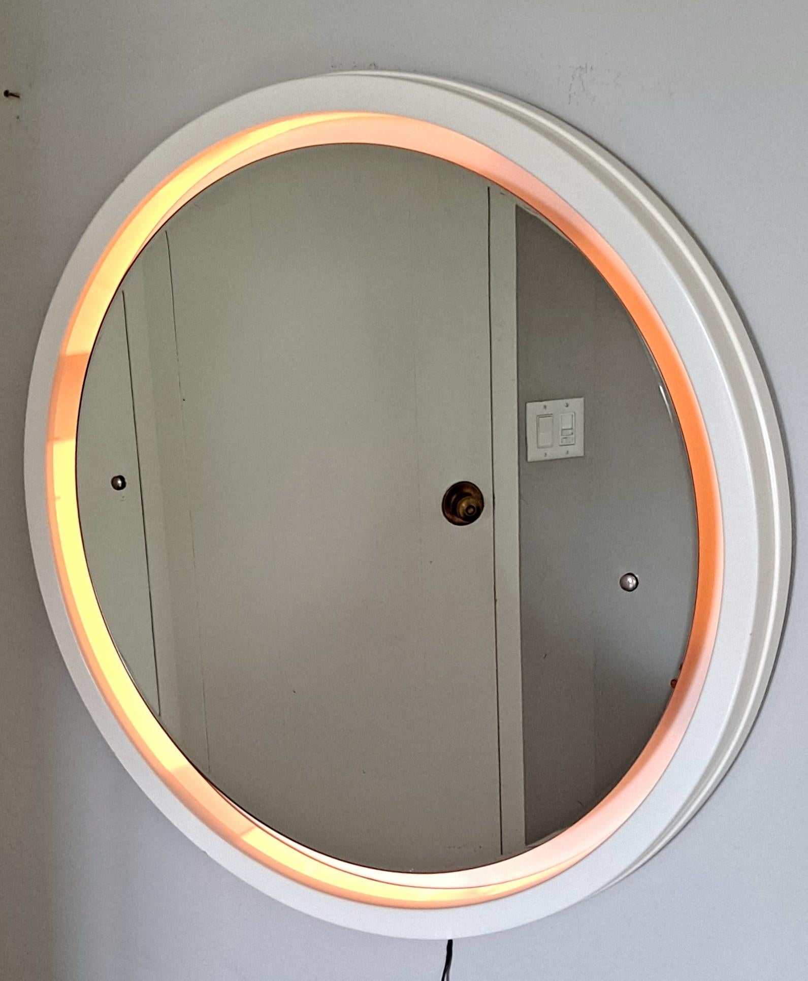 Italian wall plastic illuminate mirror.