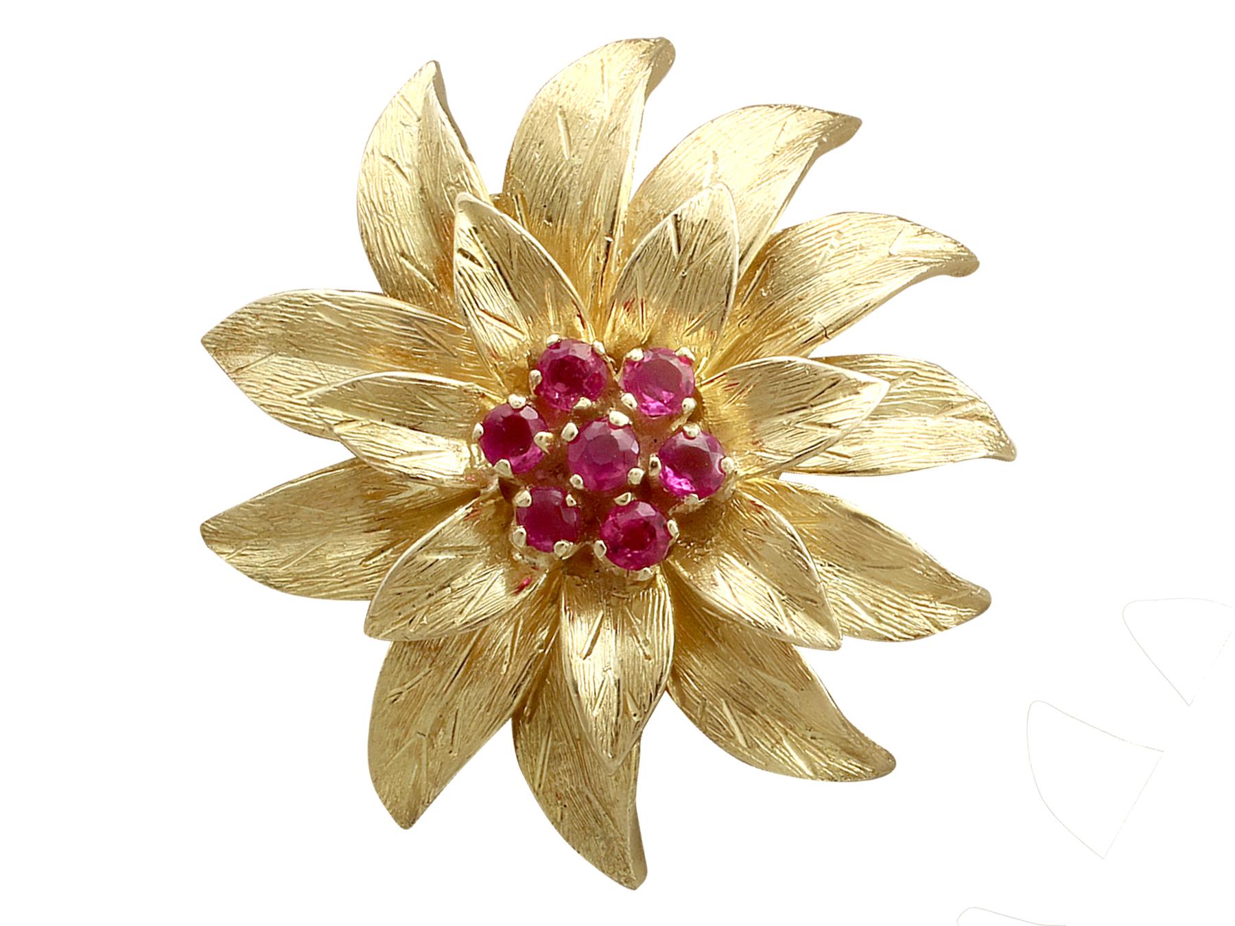 An impressive pair of vintage 0.48 carat ruby and 18 carat yellow gold floral earrings; part of our diverse gemstone jewelry collections.

These stunning, fine and impressive 18k yellow gold earrings have been modelled in the form of flowers.

Each