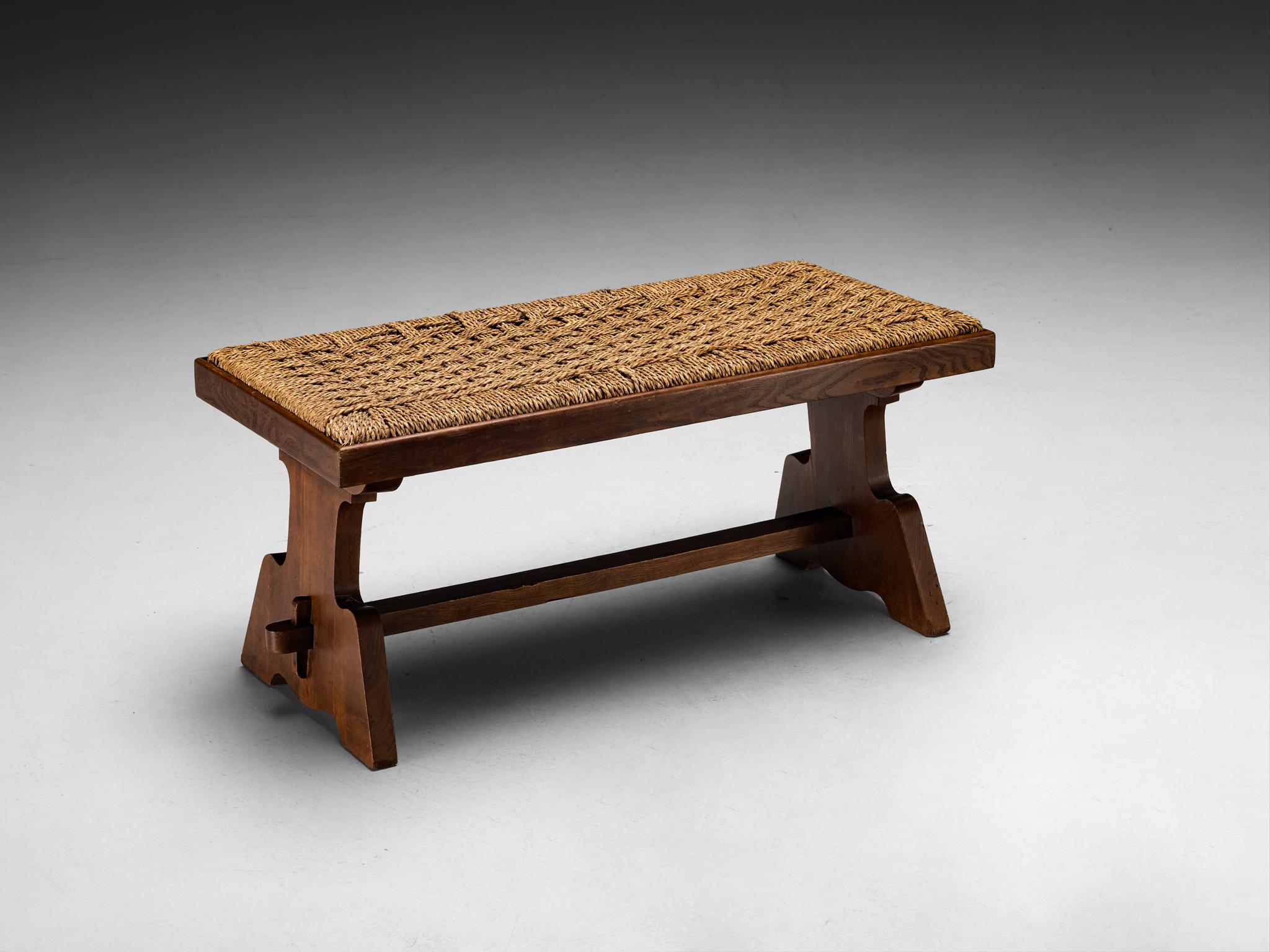 Bench, chestnut, straw, Italy, 1950s

Provincial carved bench, embodying the perfect balance of rustic charm and a sense of robustness. The frame is crafted with elegance, showcasing graceful undulating carvings contrasted with robust, sturdy lines.