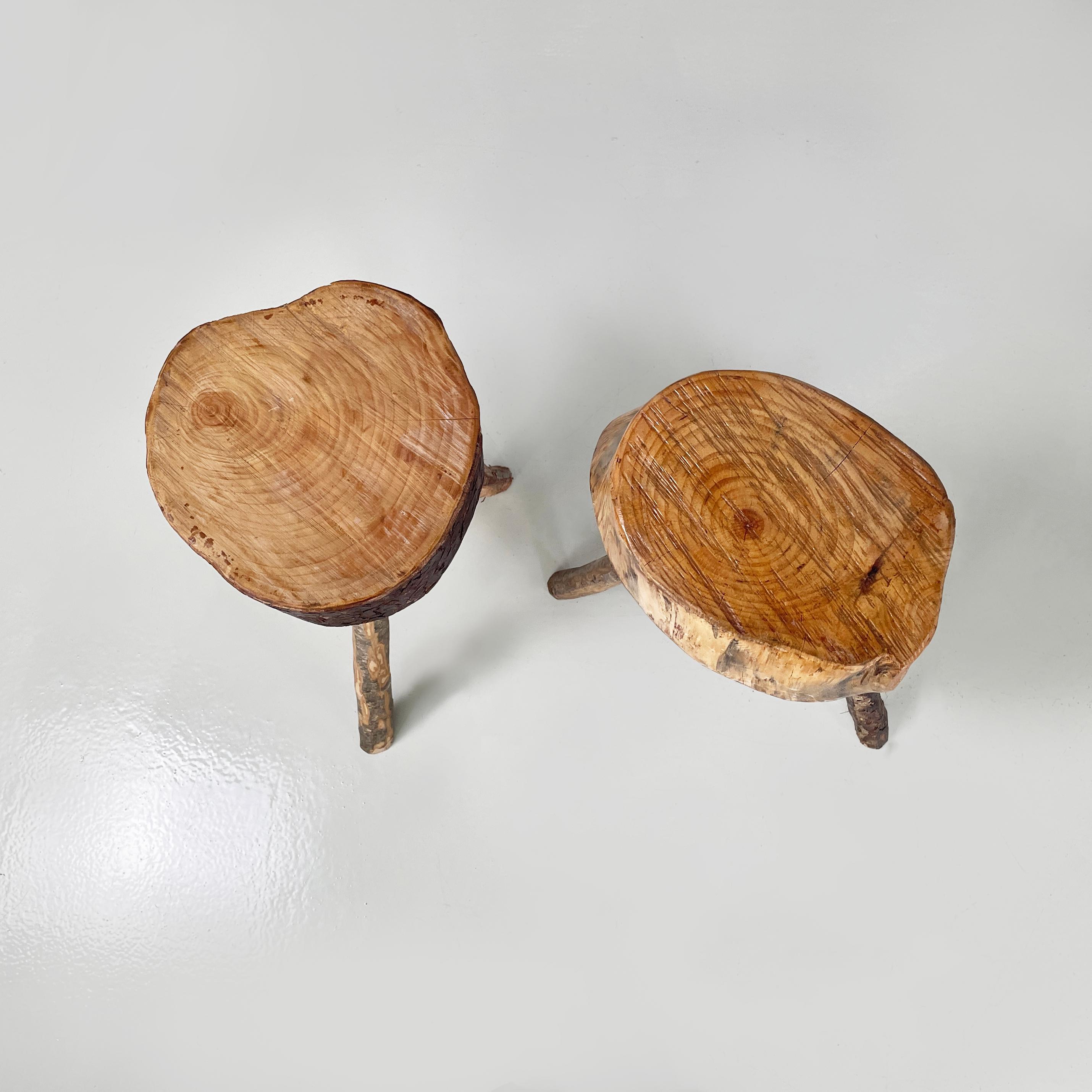 Italian Rustic table stools with different heights in wood, 2000s
Pair of rustic table stools with different heights, entirely made of wood. The seat of both comes from a part of a tree trunk, carved and finished, in fact they have irregular shapes.