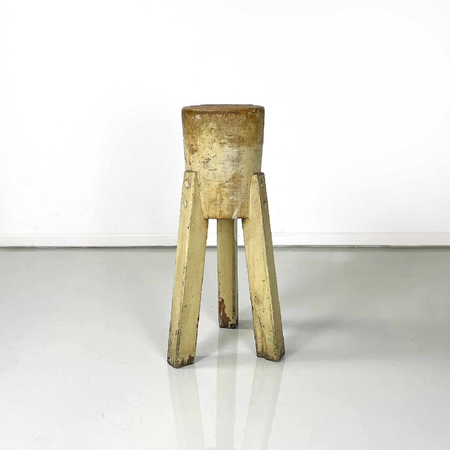 Italian rustic wooden pedestal or stool with three legs, 1970s
Rustic three-legged pedestal or stool. The seat or support is composed of a wooden cylinder to which three legs, also in wood, with a square section are joined. The item was originally