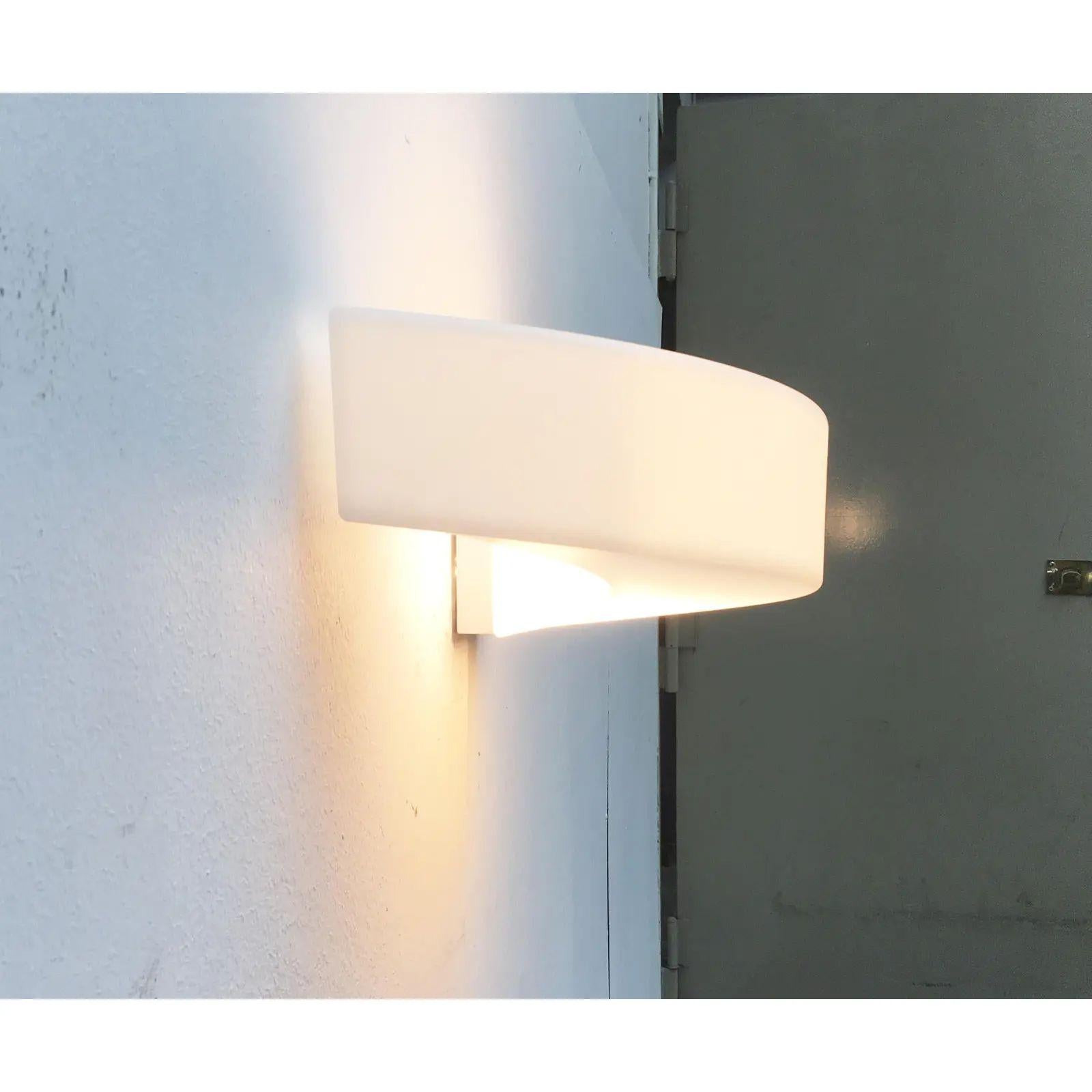 Wall lamp from the Saturn series by the Italian manufacturer Linea.

The lamp is characterized by its organic design. An open ring, the twists, and screwed up and stops short of the wall. The light is only on one side fixed to the wall and leaves a