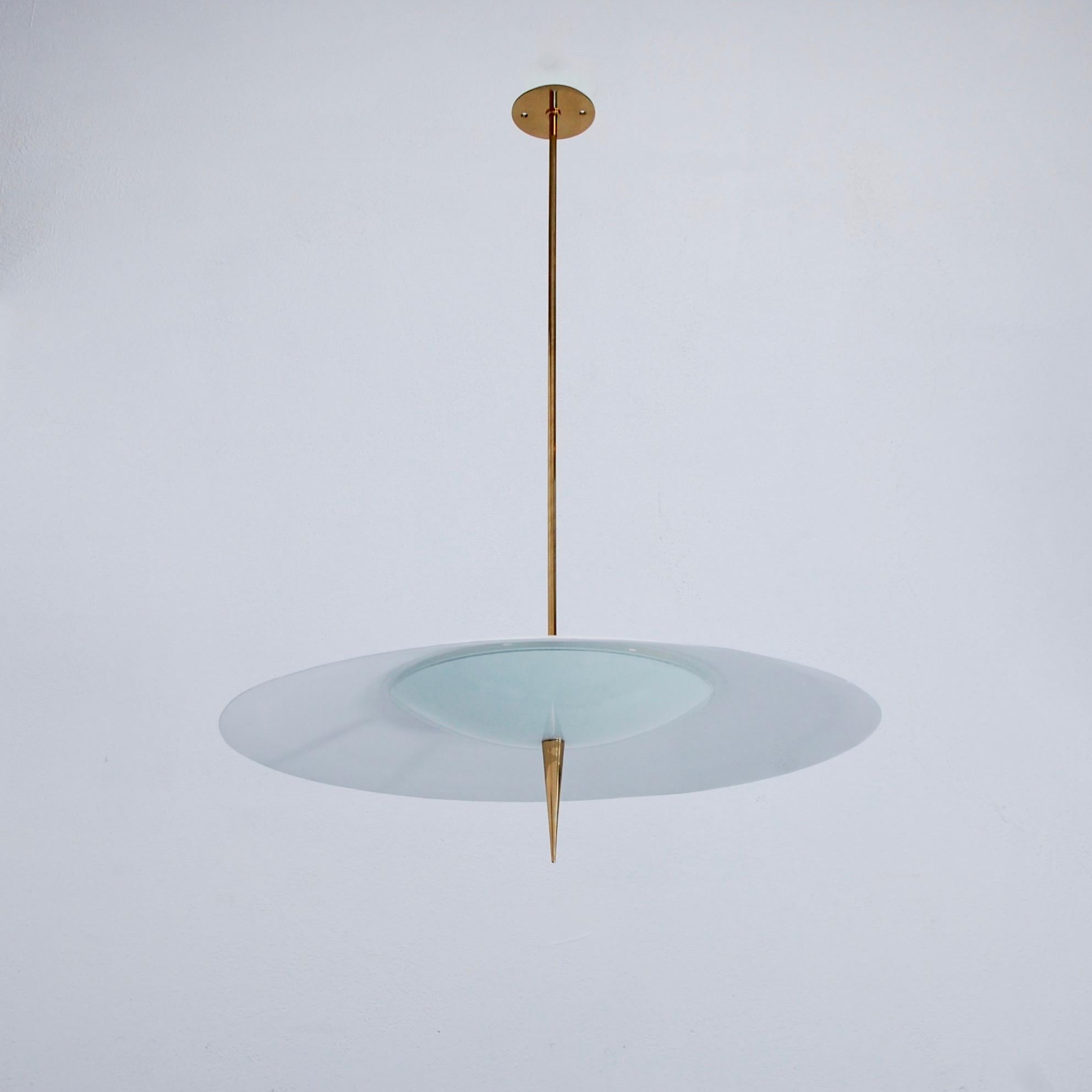 Elegant circular saucer pendant from 1960s Italy in glass, brass and painted aluminum. Partially restored. Wired for the US with a three E12 candelabra based sockets. Light bulbs included. Overall drop adjustable upon request.
Measurements:
OAD