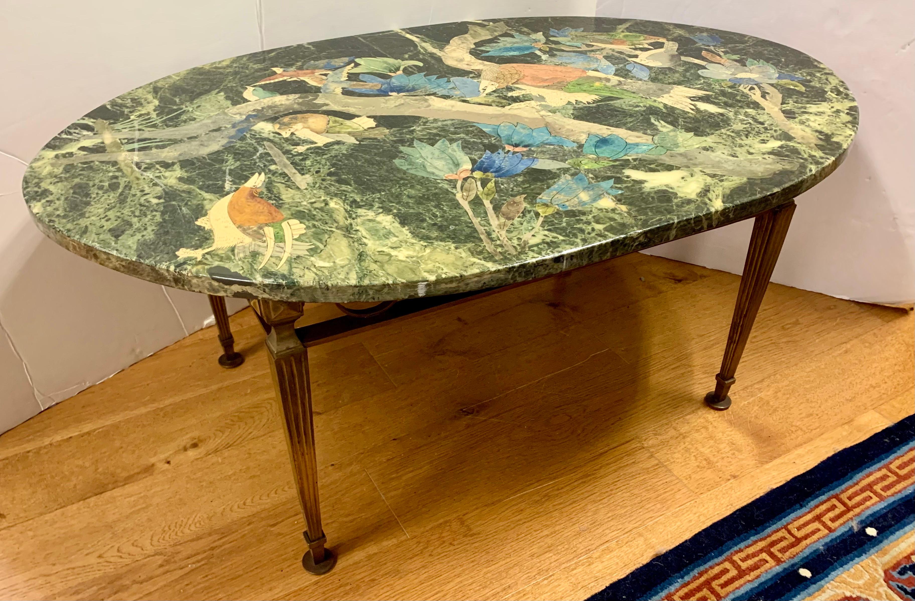 Stunning one-of-a-kind Italian scagliola marble table top hand painted with a motif of depicting various colorful birds perched on tree branches mounted on a bronze base.