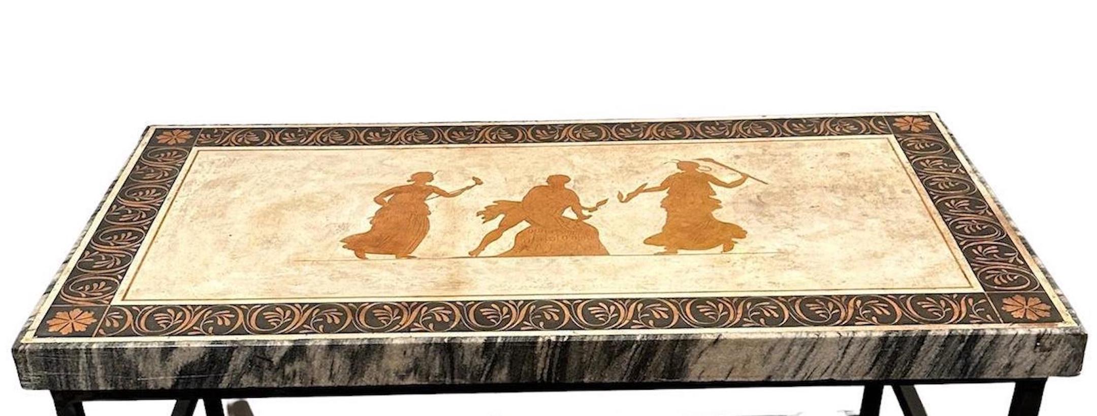 An antique, marble trimmed, inlaid scagliola table top depicting Greek mythology figures on an iron base of a later date.