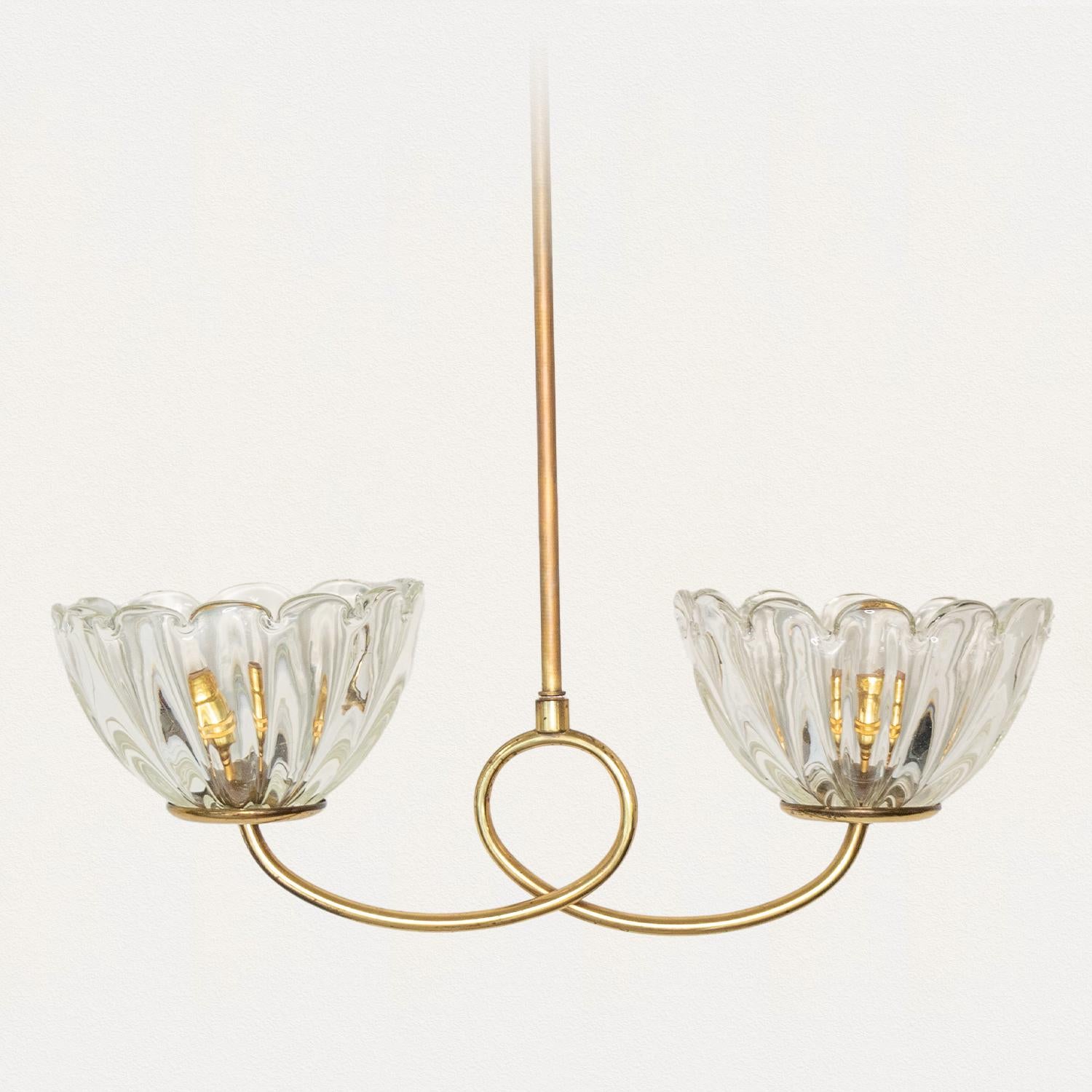 Lovely Italian glass pendant light with two blown Murano glass shades with wavy scalloped edge. Beautiful looped brass stem in original finish showing nice age and patina. Newly wired and newly added brass canopy.

Overall height is 32