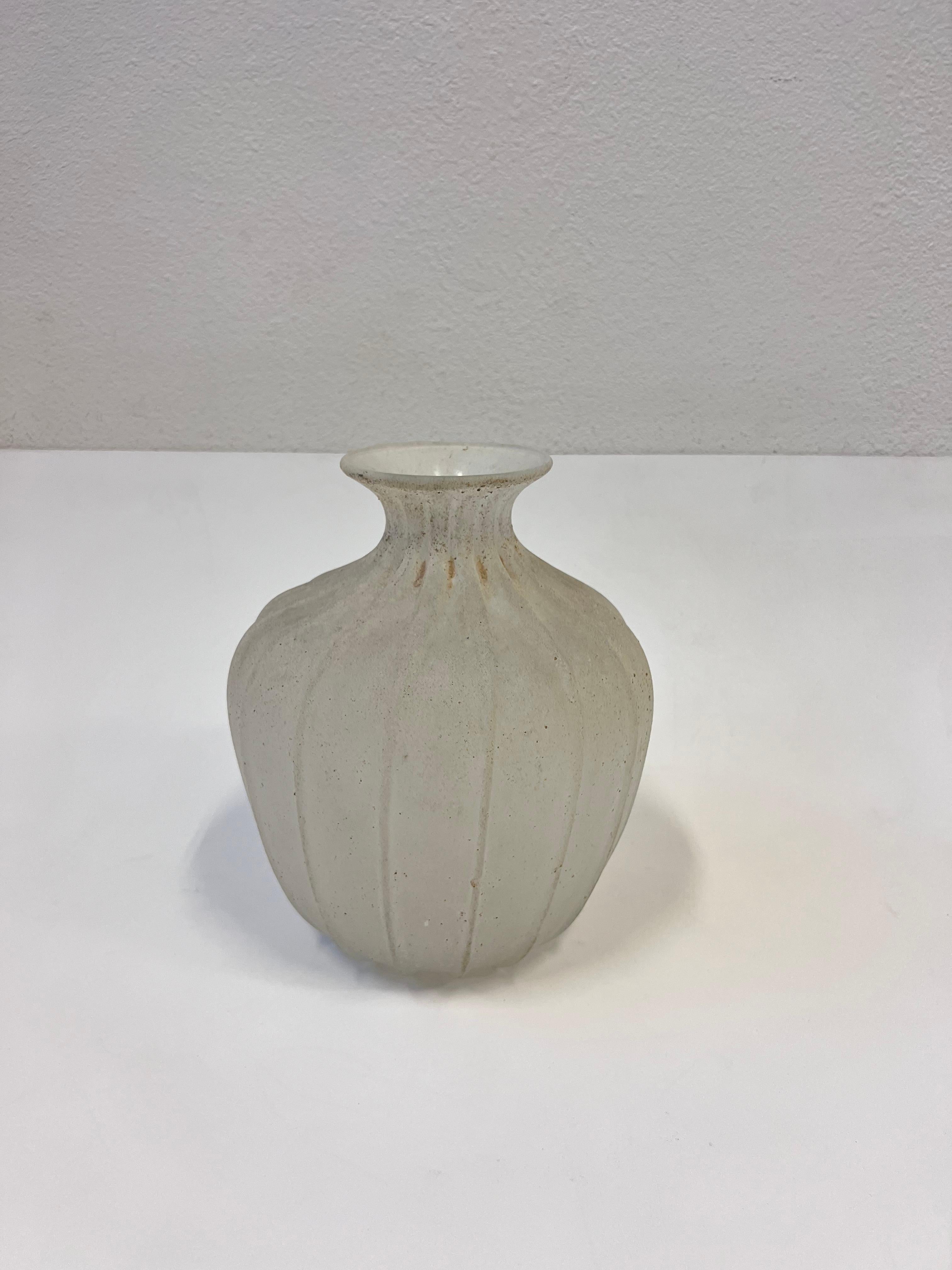 1980’s Italian Scavo Murano glass vase by Seguso Vetri d'Arte. 

Hand blown Murano glass with rough texture finish. The vase is marked Seguso Vetri d'Arte. 

Dim: 11” High, 10” Diameter. 