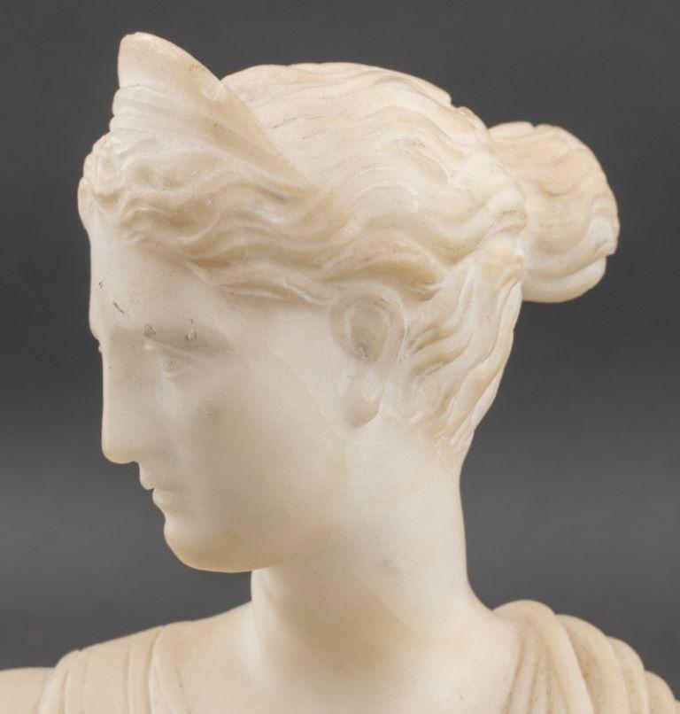 Italian School Diana of Versailles (Early 19th century), White Marble Bust on round marble base, labeled 
