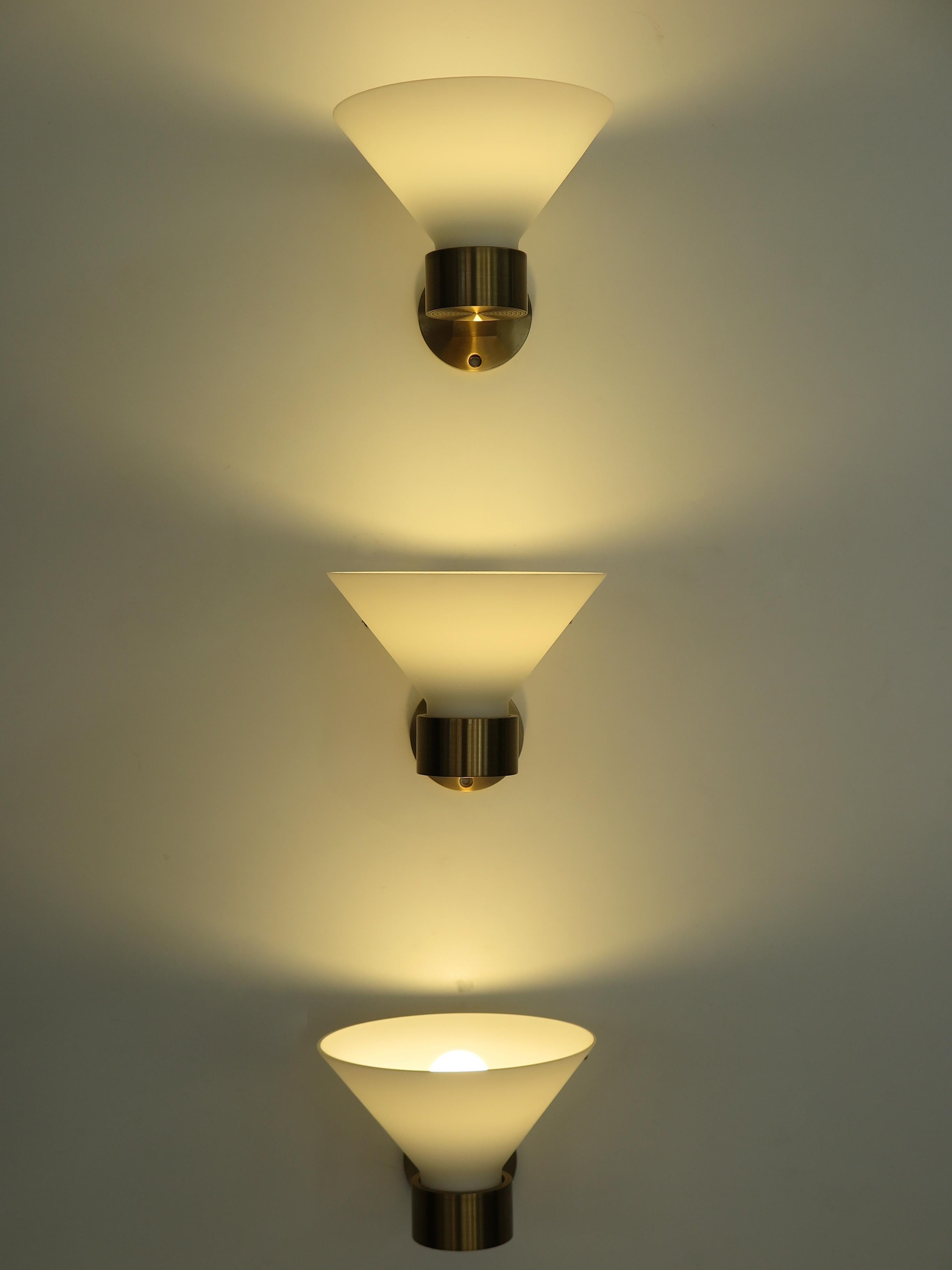 Set of three Italian wall sconces or wall lamps with solid brass frame and Murano glass lampshade, 1970s/80s.