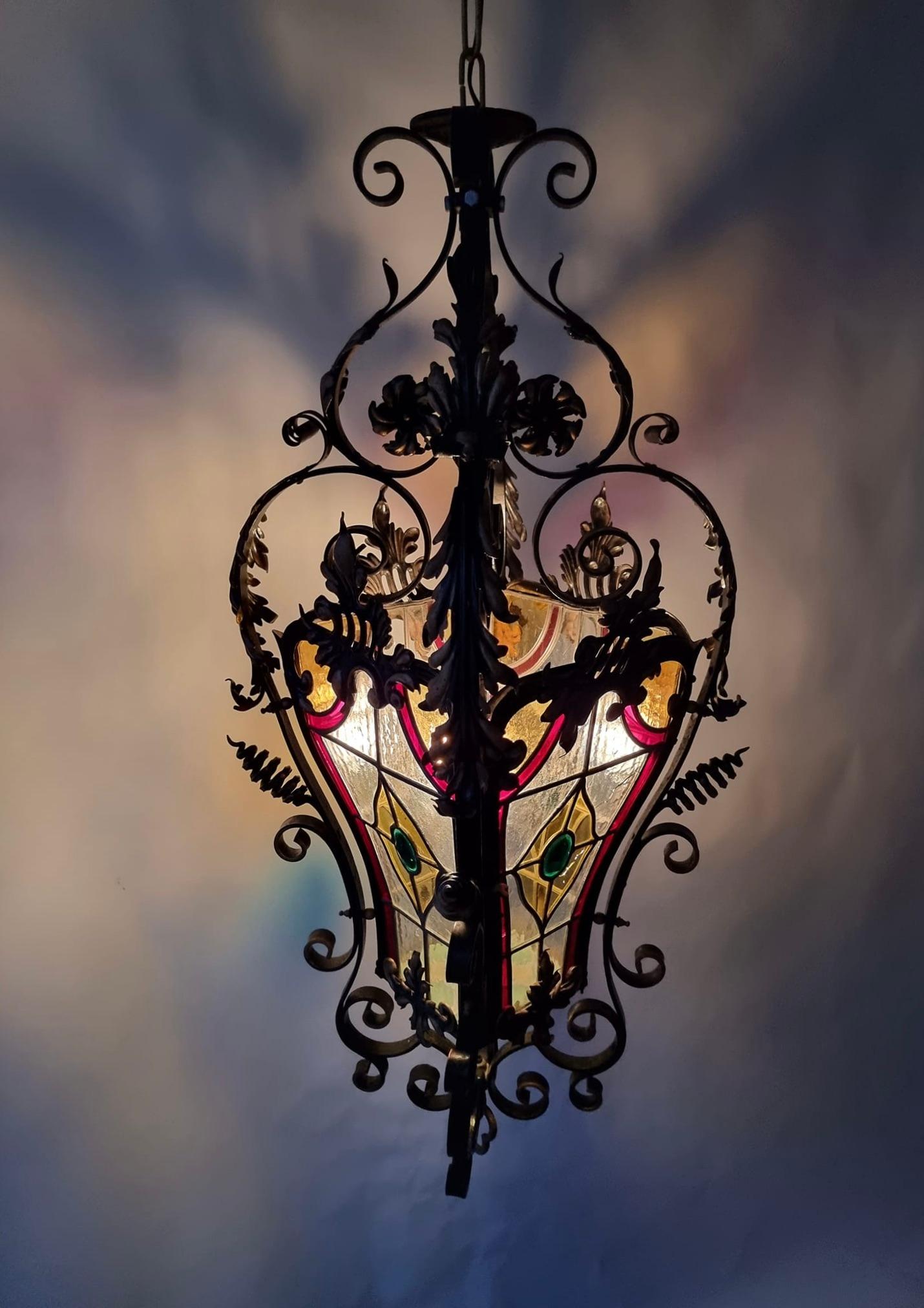 20th Century  Italian Scrolled Wrought Iron and Stained Glass Hanging Hall Lantern, C. 1900 For Sale