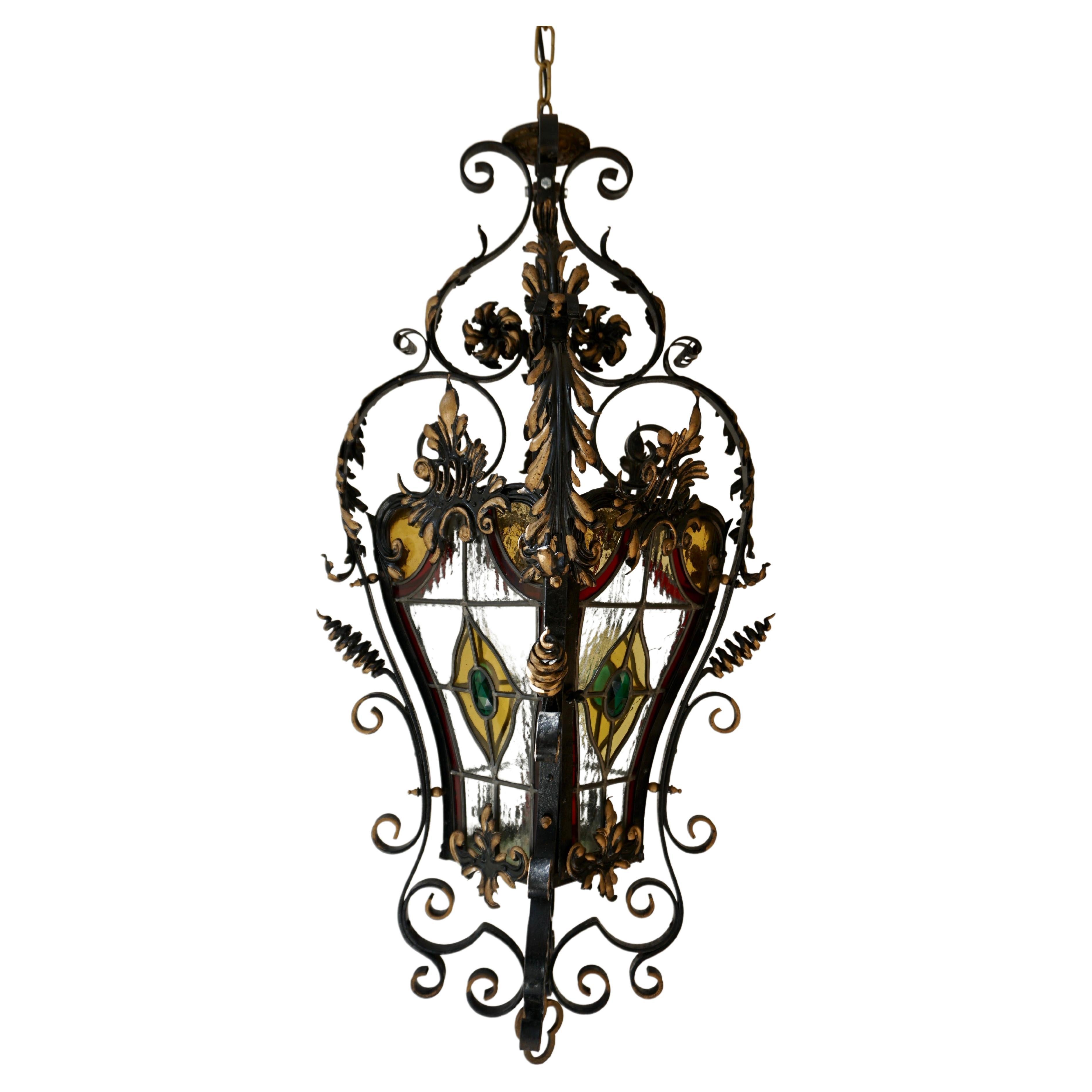  Italian Scrolled Wrought Iron and Stained Glass Hanging Hall Lantern, C. 1900 For Sale