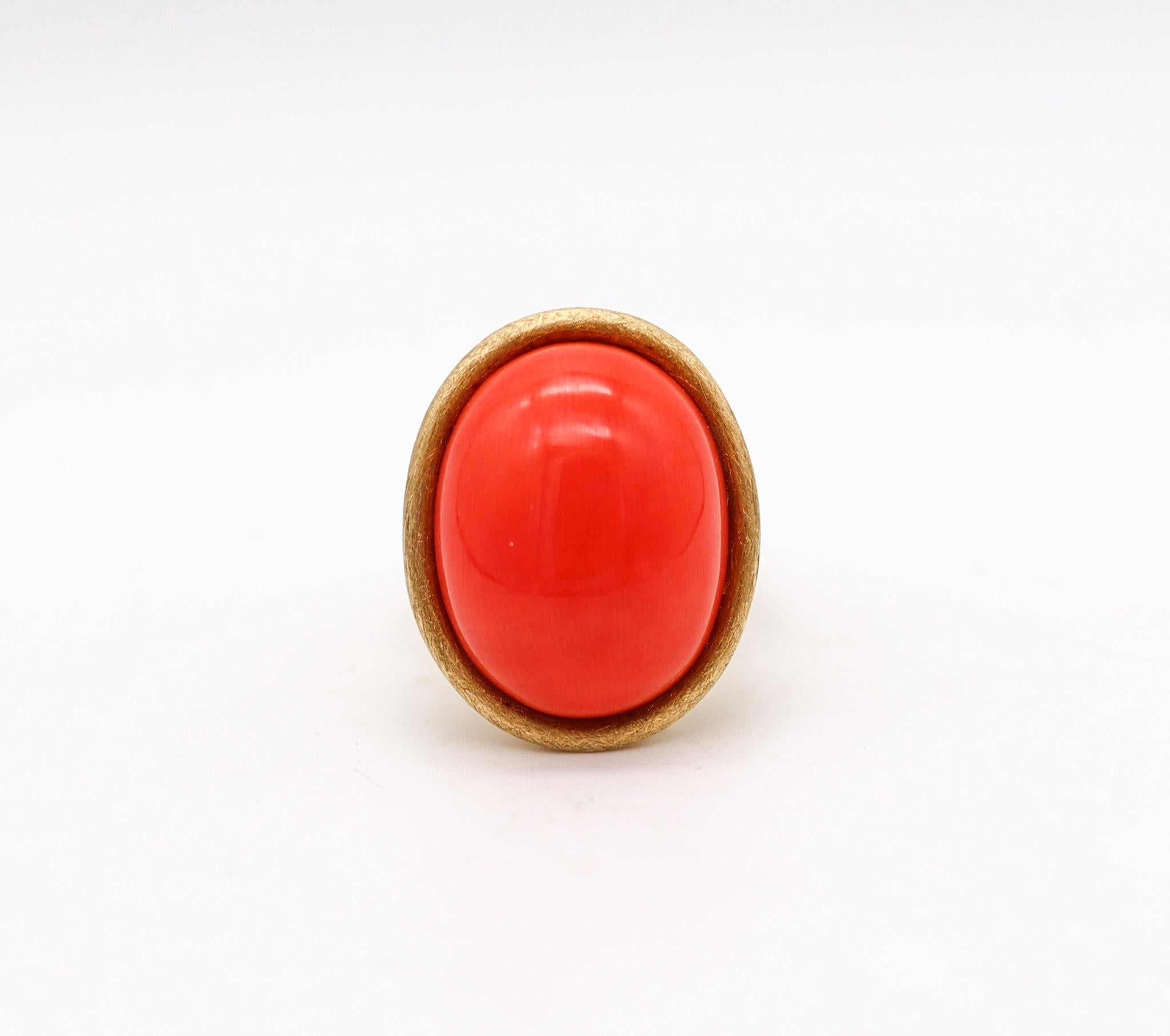 Sculptural cocktail ring with Italian coral.

Stupendous cocktail ring, created in Italy in the late 20th century. This chic and modern ring was crafted with sculptural modernist shapes in solid yellow gold of 18 karats with textured brushed finish.