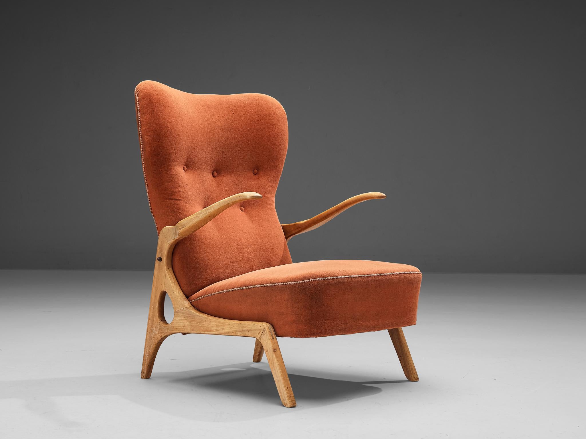 Lounge chair, pine, fabric, Italy, 1950s

This well-designed lounge chair features a characteristic wooden frame executed in cherry. The biomorphic looking armrests represent naturally occurring shapes reminiscent of nature. These patterns are also