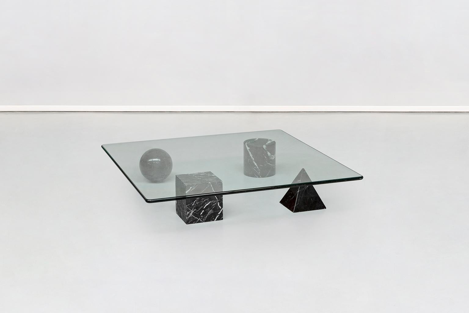 Italian sculptural Metafora coffee table by Vignelli for Martinelli Luce, 1979
A stunning and sculptural coffee table inspired by the four forms of Euclidean geometry, the cube, the pyramid, the cylinder and the sphere. The four elements can be