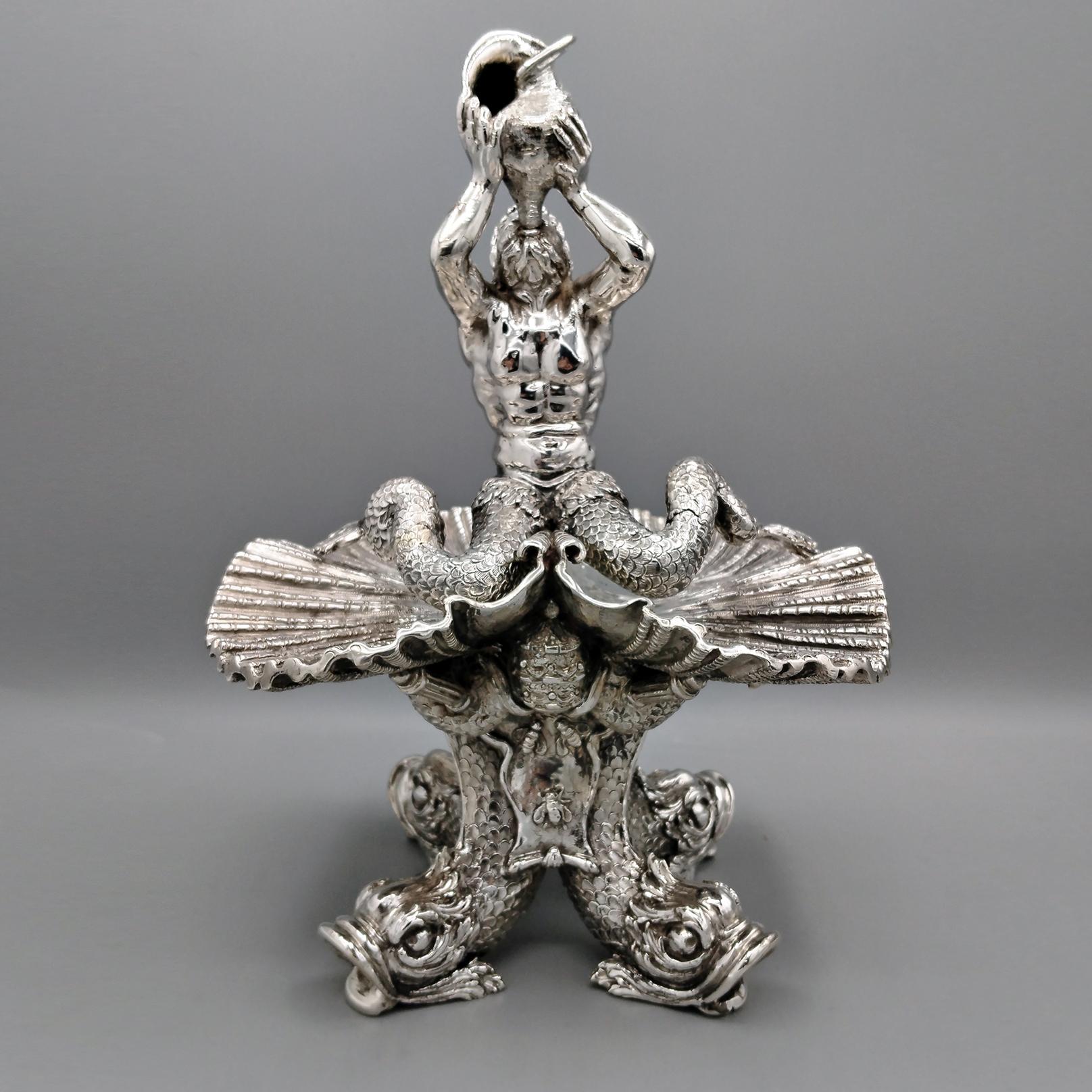 Solid silver reproduction of the Triton Fountain located in Rome in Piazza Barberini and made by Gian Lorenzo Bernini between 1642 and 1643.
The sculpture was made with the casting technique and subsequently engraved and chiseled to make it more