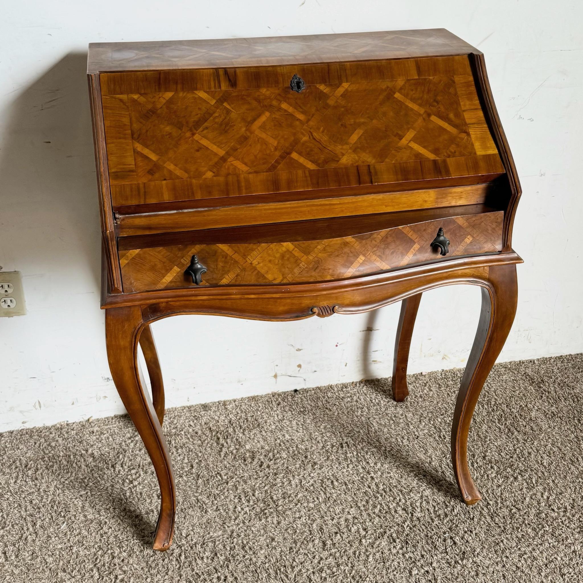 Bring timeless elegance to your home with this Italian secretary desk featuring exquisite burl wood inlay. The intricate craftsmanship and stunning inlay detail showcase the artistry of Italian furniture design. Offering both beauty and