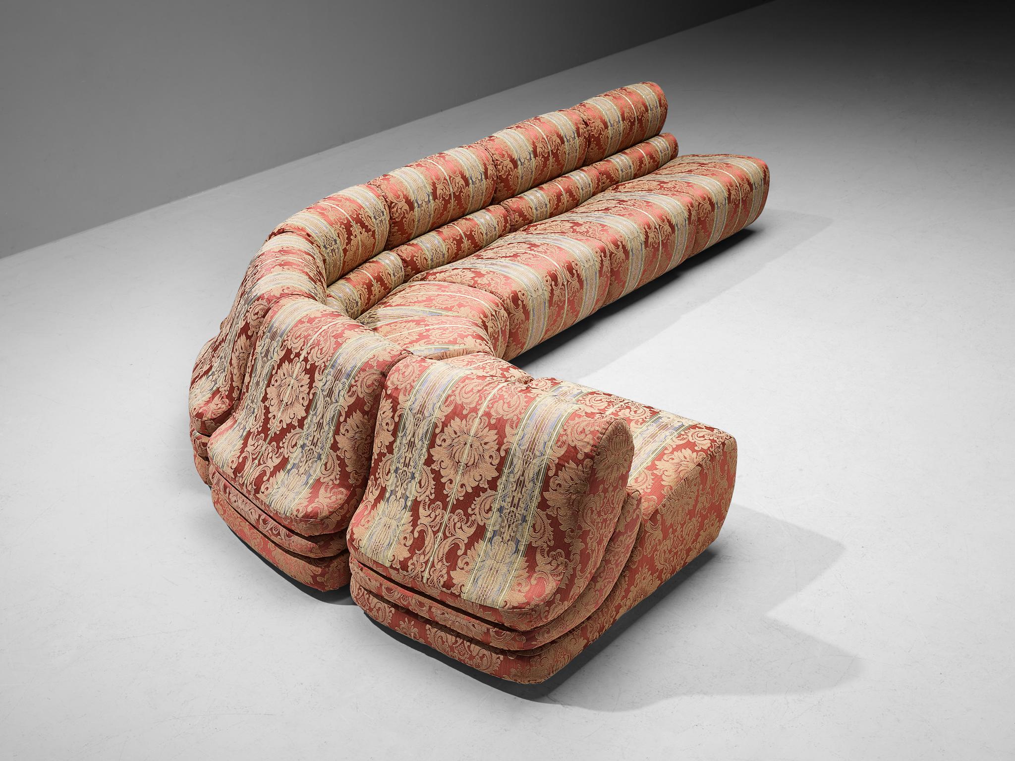 Modular sofa, fabric, Italy, 1970s

This grandiose characteristic sofa of Italian origin finds itself at the intersection of art and furniture design. The modular sofa contains four regular elements and three corner pieces, making it possible to