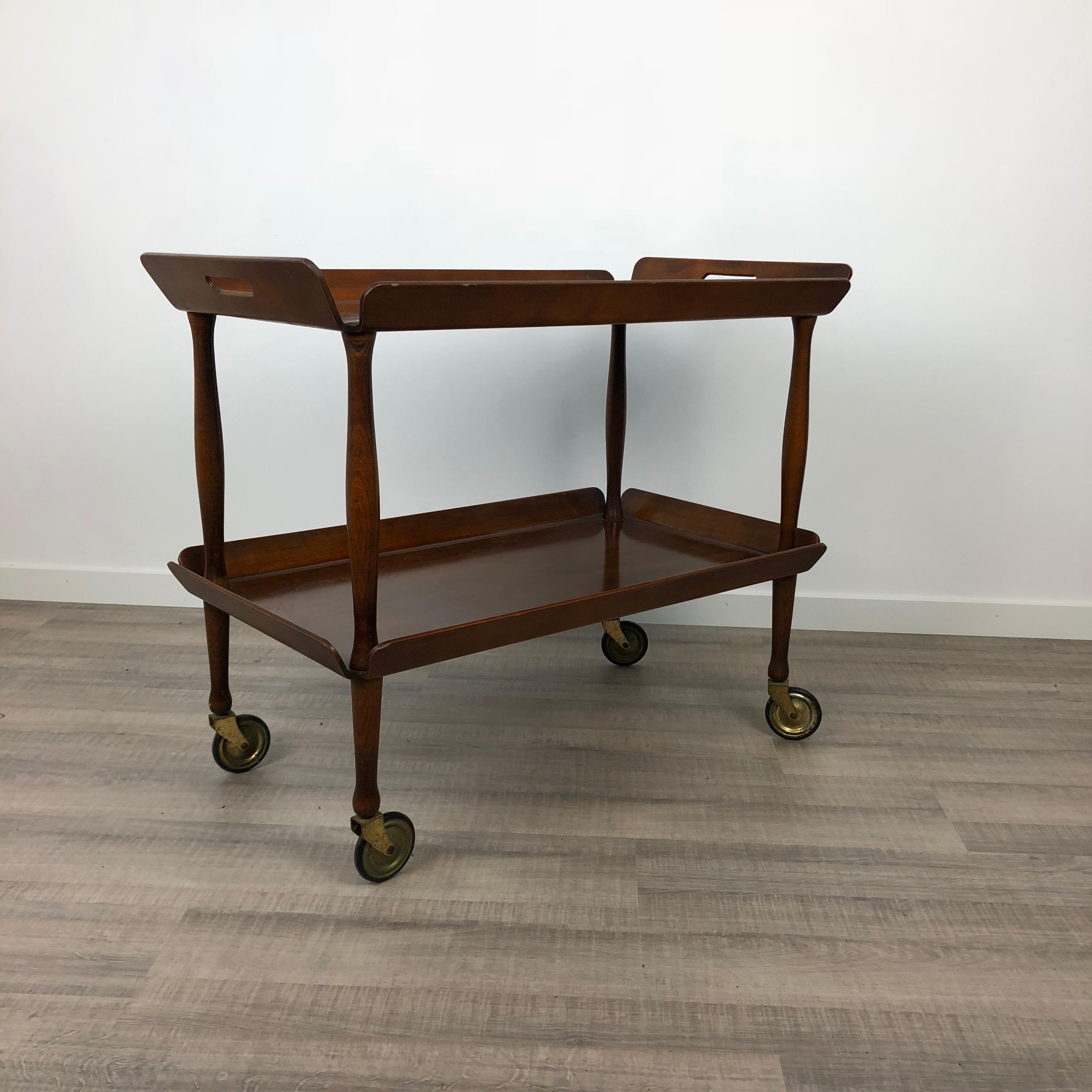 Serving cart with double trays made in wood with a brass structure. Italy, 1950s.