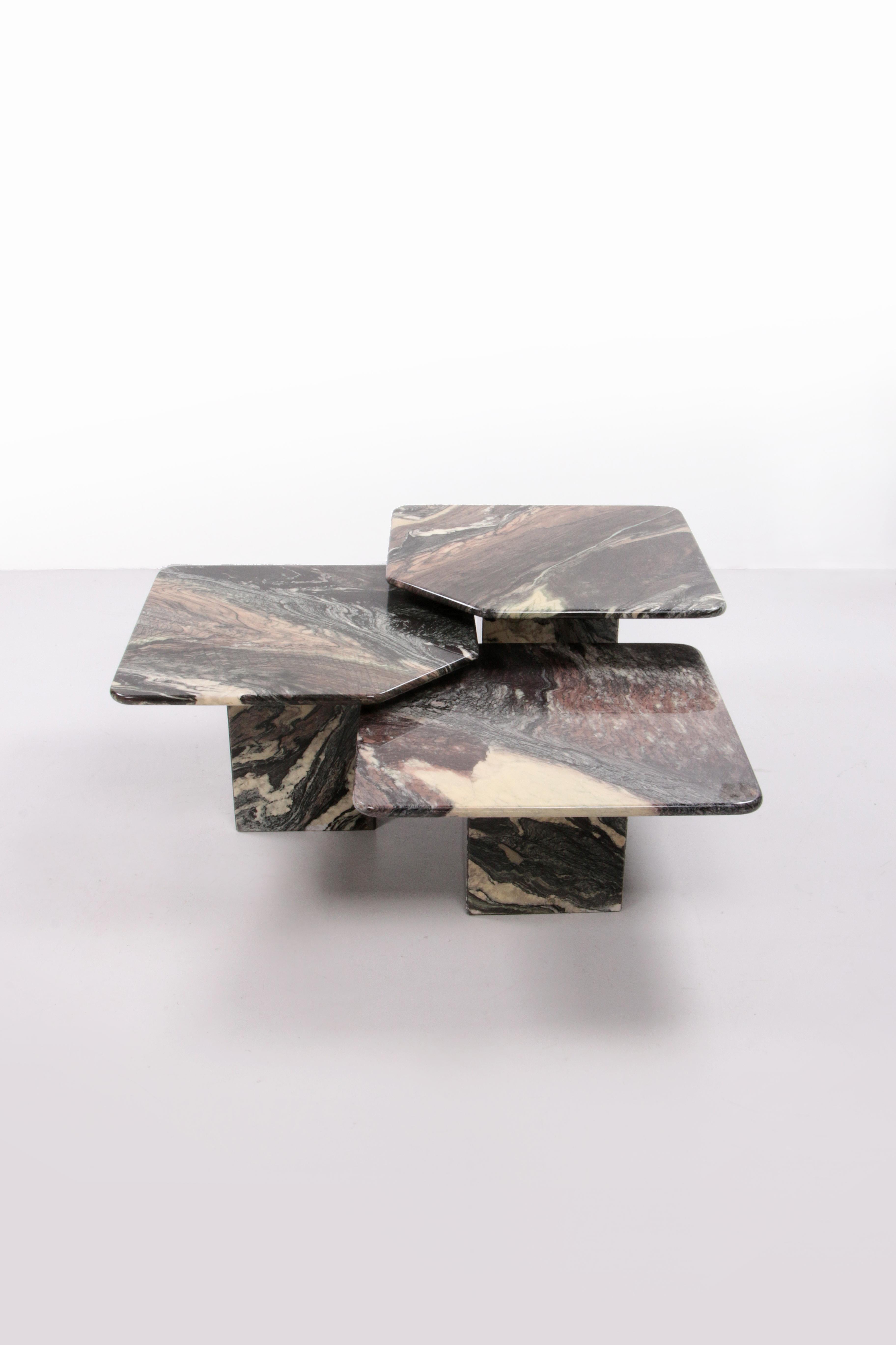 Italian Set of 3 Marble side tables handmade, 1970


Italian design set of three coffee or side tables in Italian black anthracite and cream mixed marble, handmade by craftsmen. A minimalist piece of furniture that can take any modern living room to