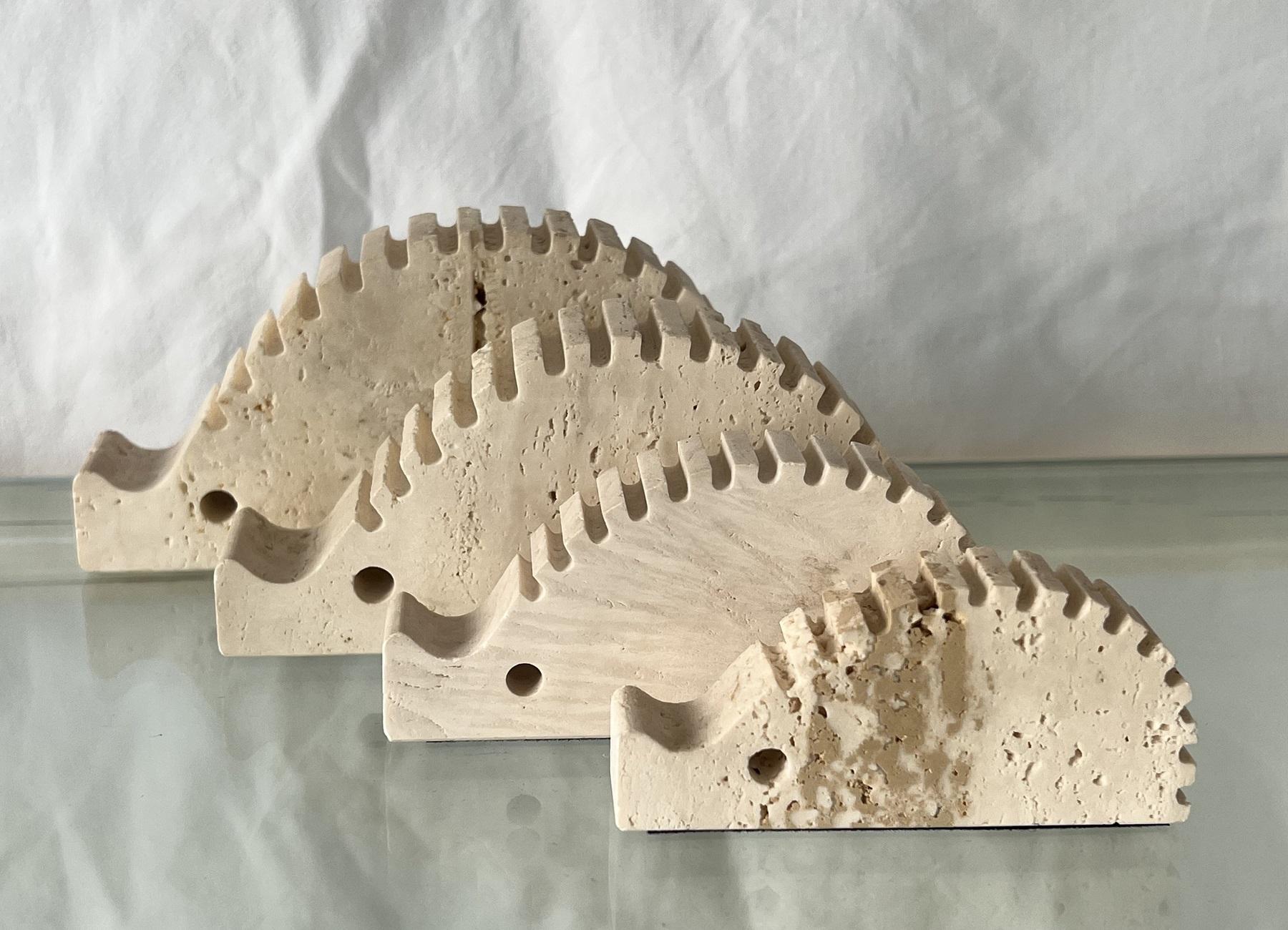 Beautiful set consisting of 4 hedgehogs in different sizes made of travertine stone.
The hedgehogs are handcrafted and are in excellent, clean condition. 
Since travertine stone is a natural material, the stone spores and colors are completely