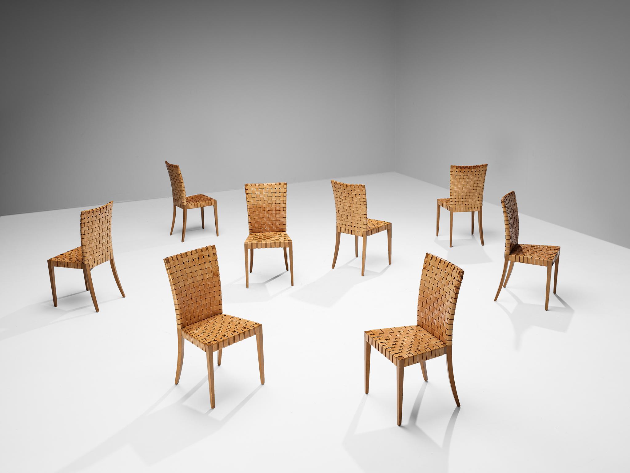 Set of eight dining chairs, cognac brown patinated leather, stained beech, Italy, 1970s

These dining chairs of Italian origin exemplify exquisite craftsmanship, skillfully rendered with a fully braided leather strap construction. This technique