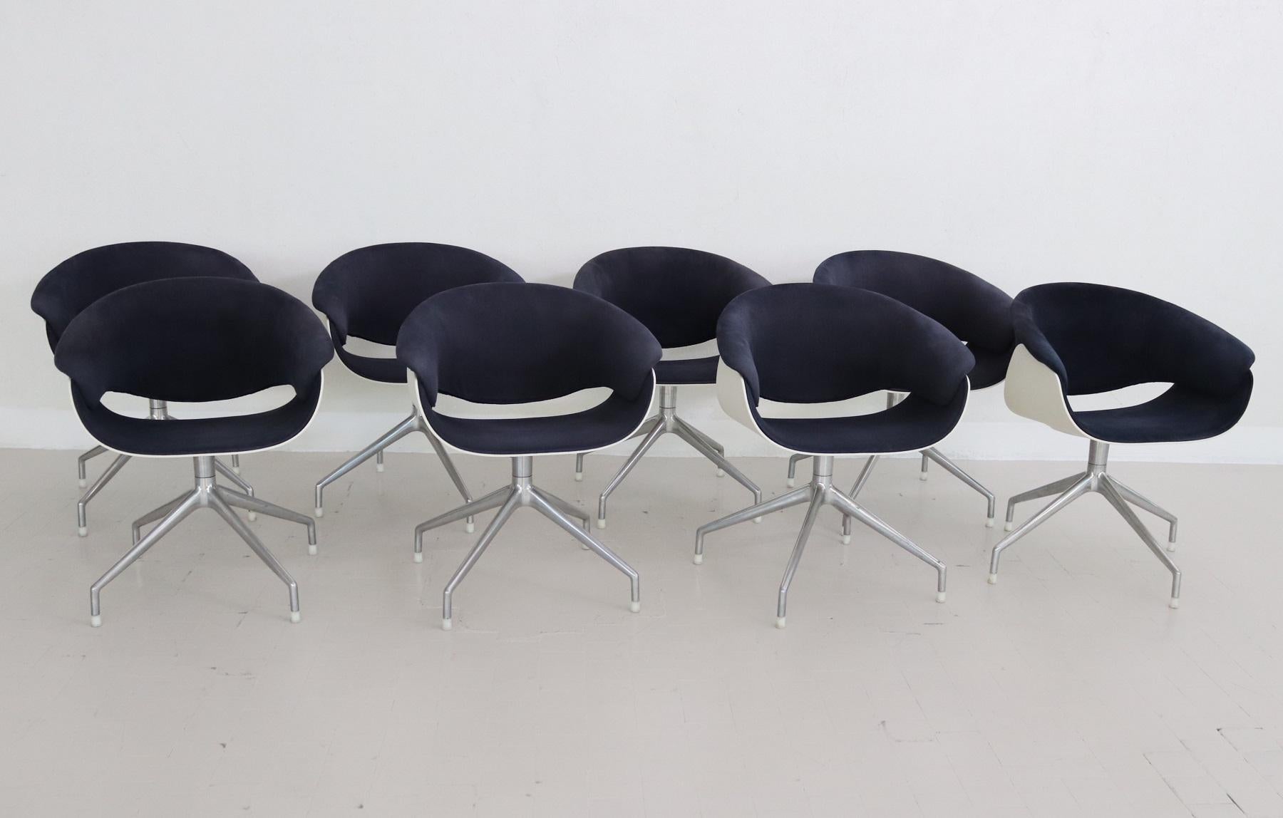 Beautiful set of eight (8) swivel chairs, suitable as dining chairs or as office chairs.
Produced by B&B Italia in 2005, Designed by Uwe Fischer, 1999.

Seat and back structure in white thermoplastic material.
Base structure (feet) in polished