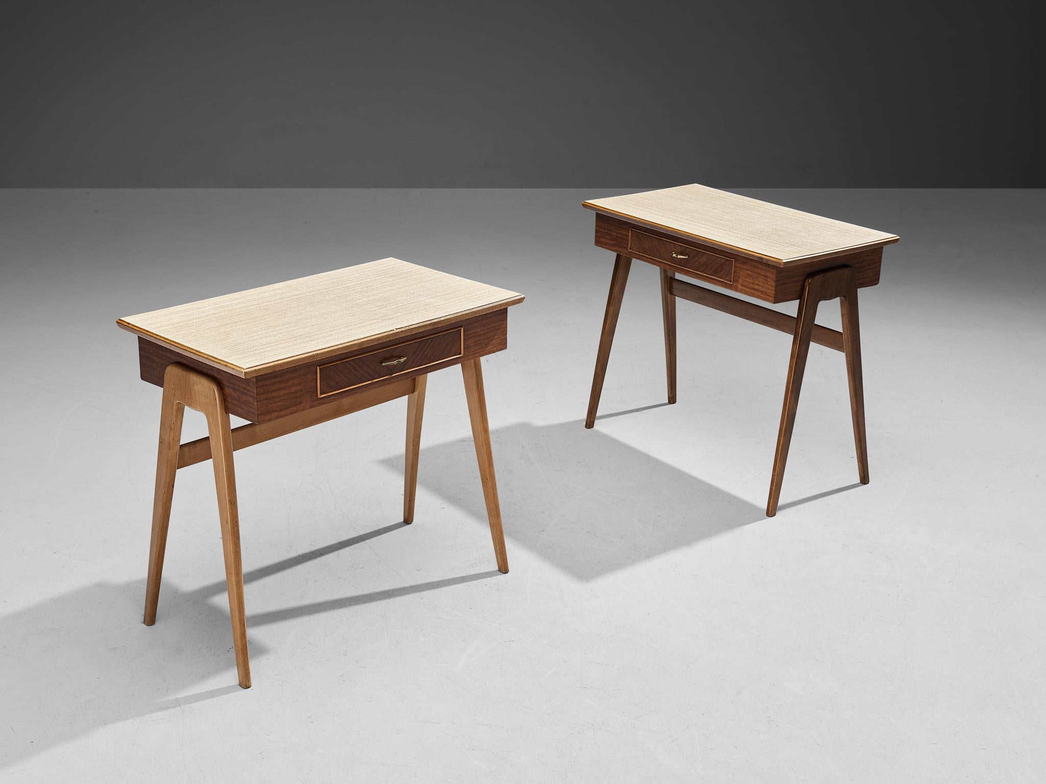 Set of writing desks, mahogany veneer, walnut, brass, formica, Italy, 1950s

Very elegant desks made in Italy in the 1950s. These desks are executed in a walnut frame. The upper part of these pieces are veneered, and the top is inlayed with a very