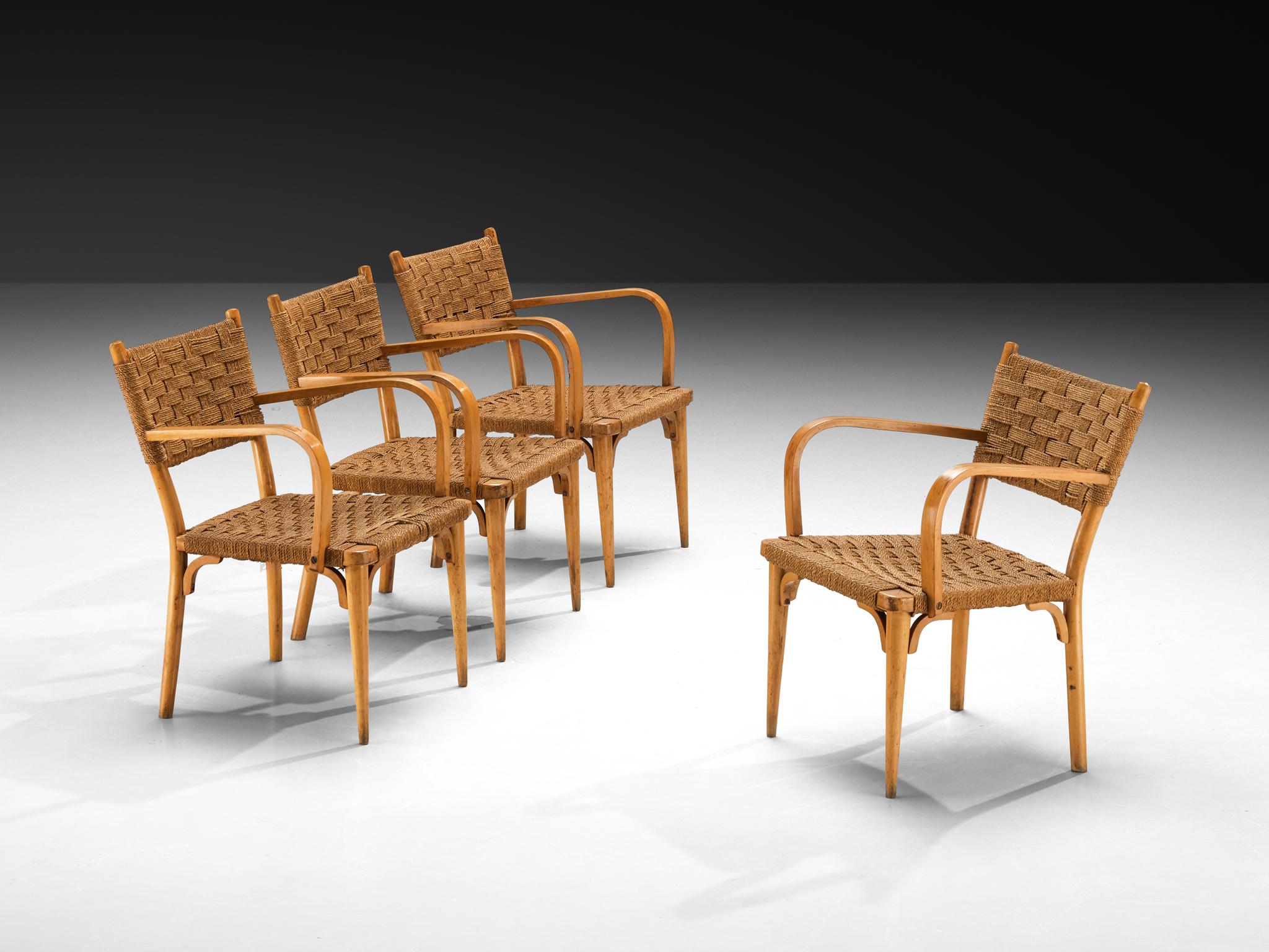 Set of four armchairs, beech, braided straw, Italy, circa 1950

This lovely set will come forward nicely in a relaxing surrounding, like a patio or a studio space. The chairs exude a rustic charm, crafted with only natural materials such as straw