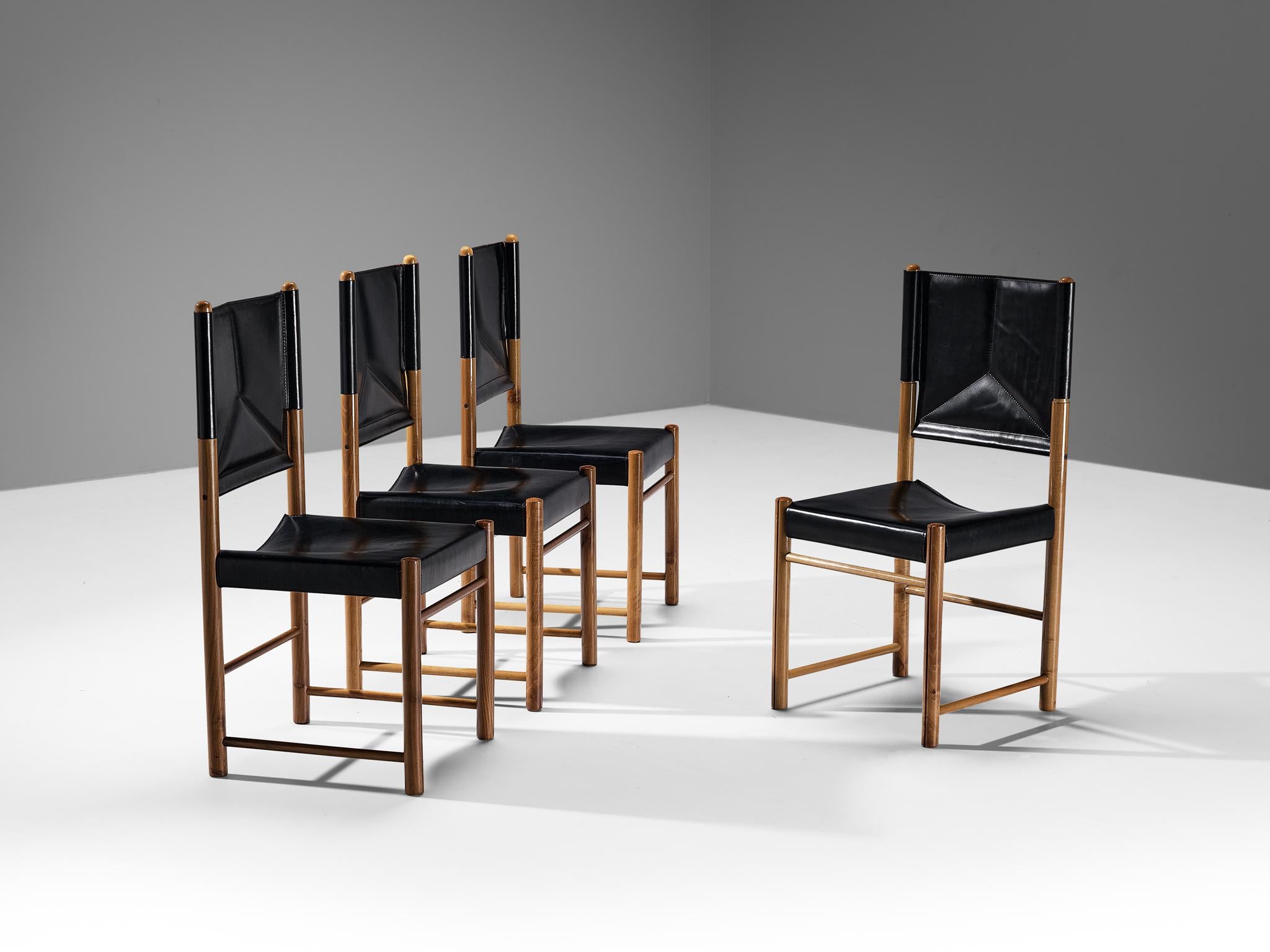 Set of four dining chairs, walnut, leather, Italy, 1970s

A delicate set of chairs that are well-proportioned and will elevate one's dining area in a vigorous and strong way. The wooden frame is composed of cylindrical beams to which the black
