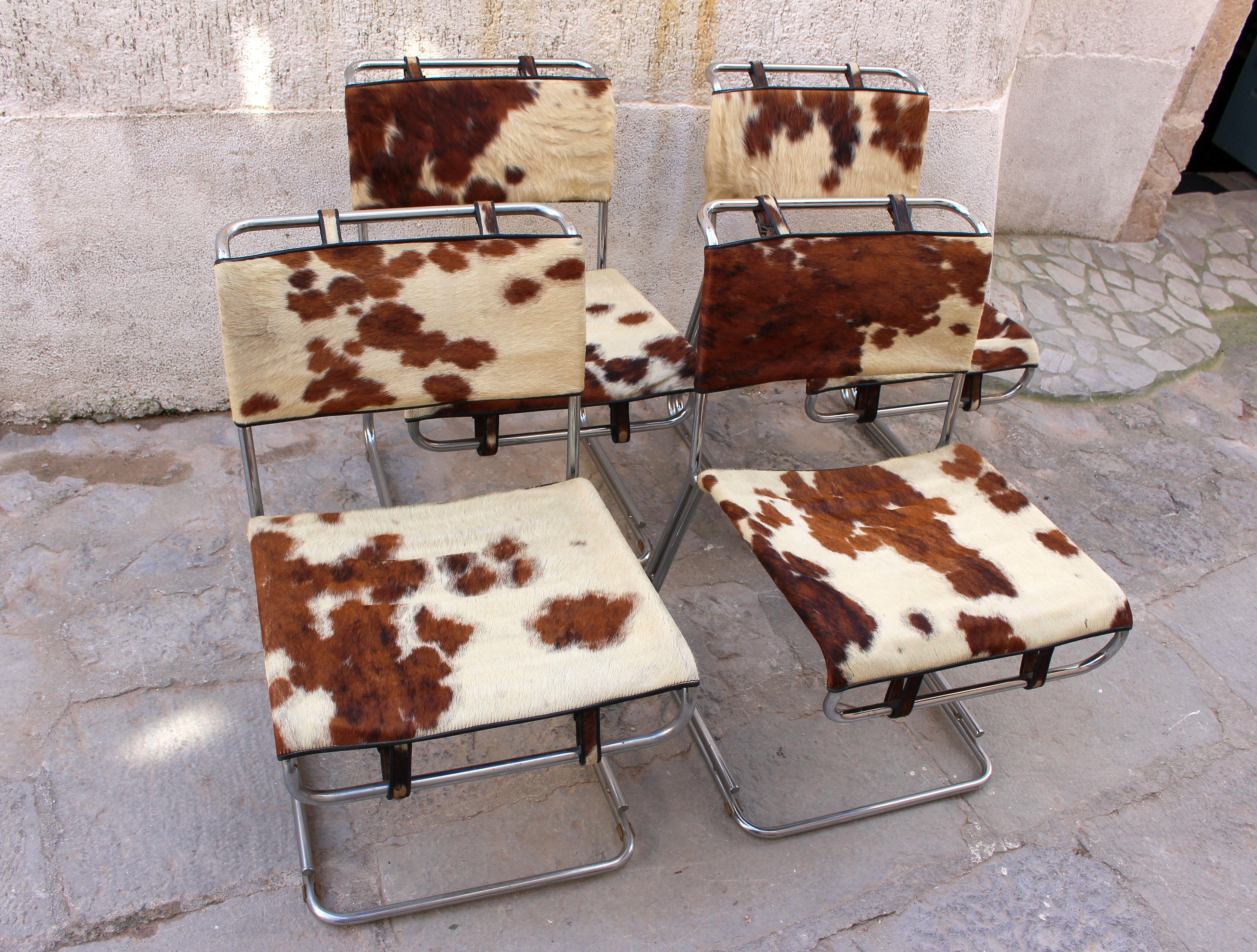 Italian vintage set of four chair, original cowhide Pony hair upholstery. Chairs are circa 1960 . It is presented as dining chairs but it could be a conference chairs. 