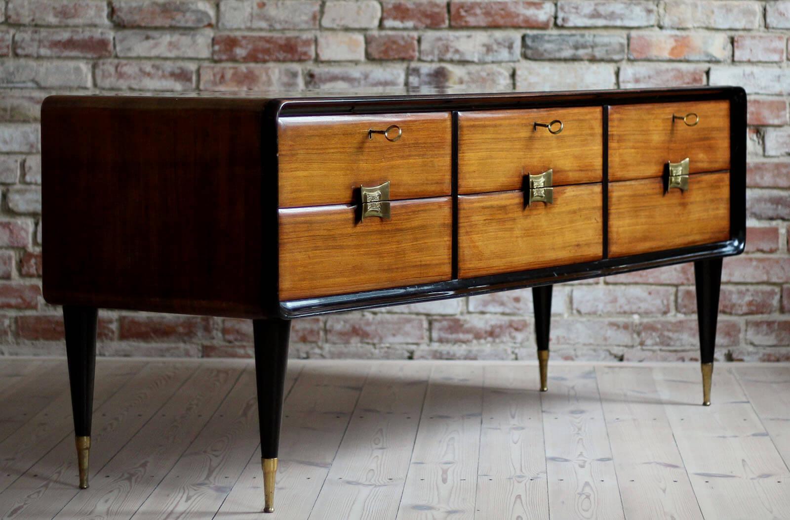 Italian set of furniture in original vintage condition. The set consists of 1 sideboard and 2 nightstands. The pieces come from Italy from circa 1950s. They show some patina consistent with age and use but remain in overall good condition. All