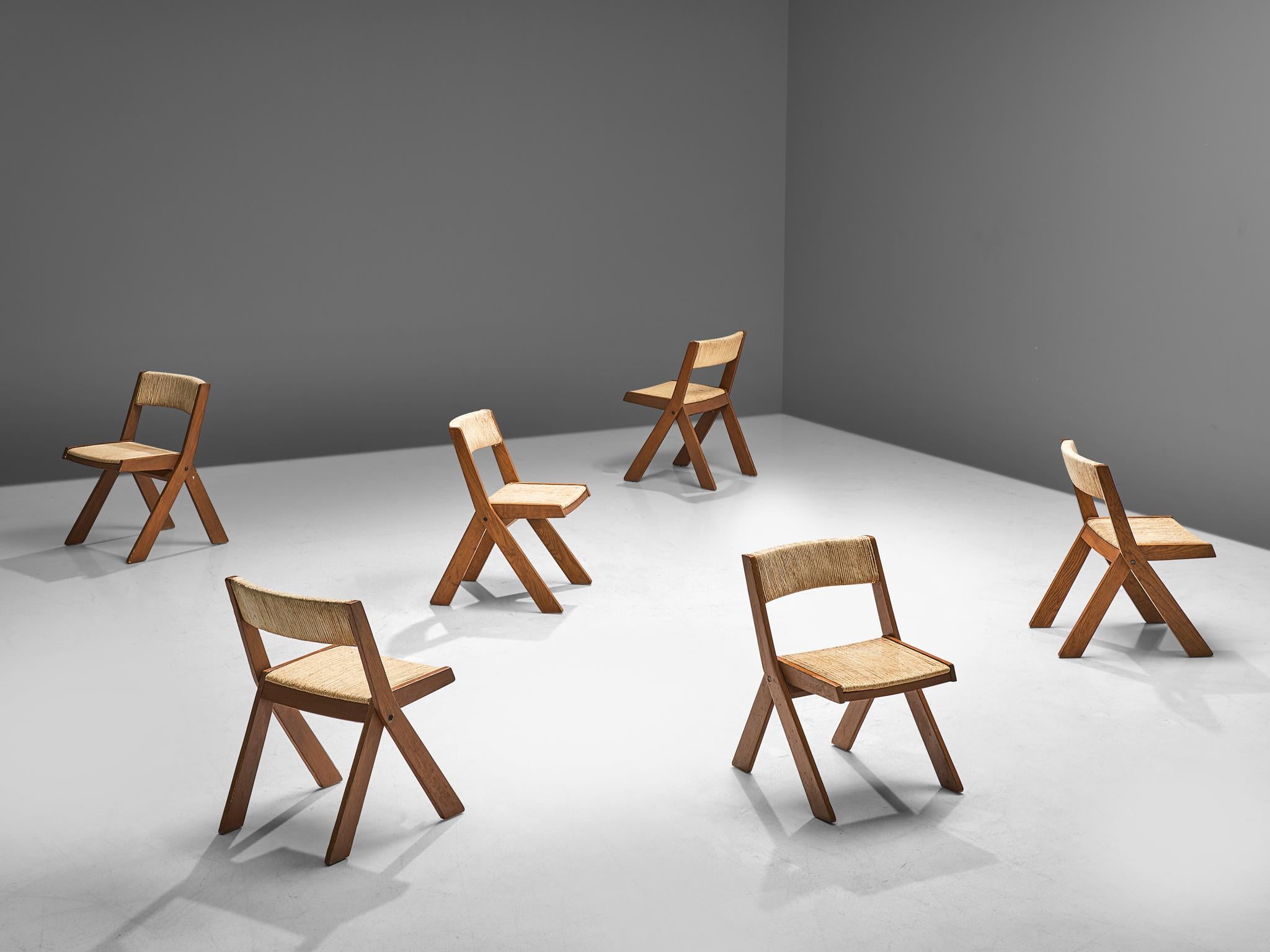 Set of 6 dining chairs, stained wood and rope, Italy, 1960s

Robust set of six dining chairs. The seats and backs are executed with rope. The stained wooden frame is sturdy, with thick flared legs. This burly and natural style is rough. This set