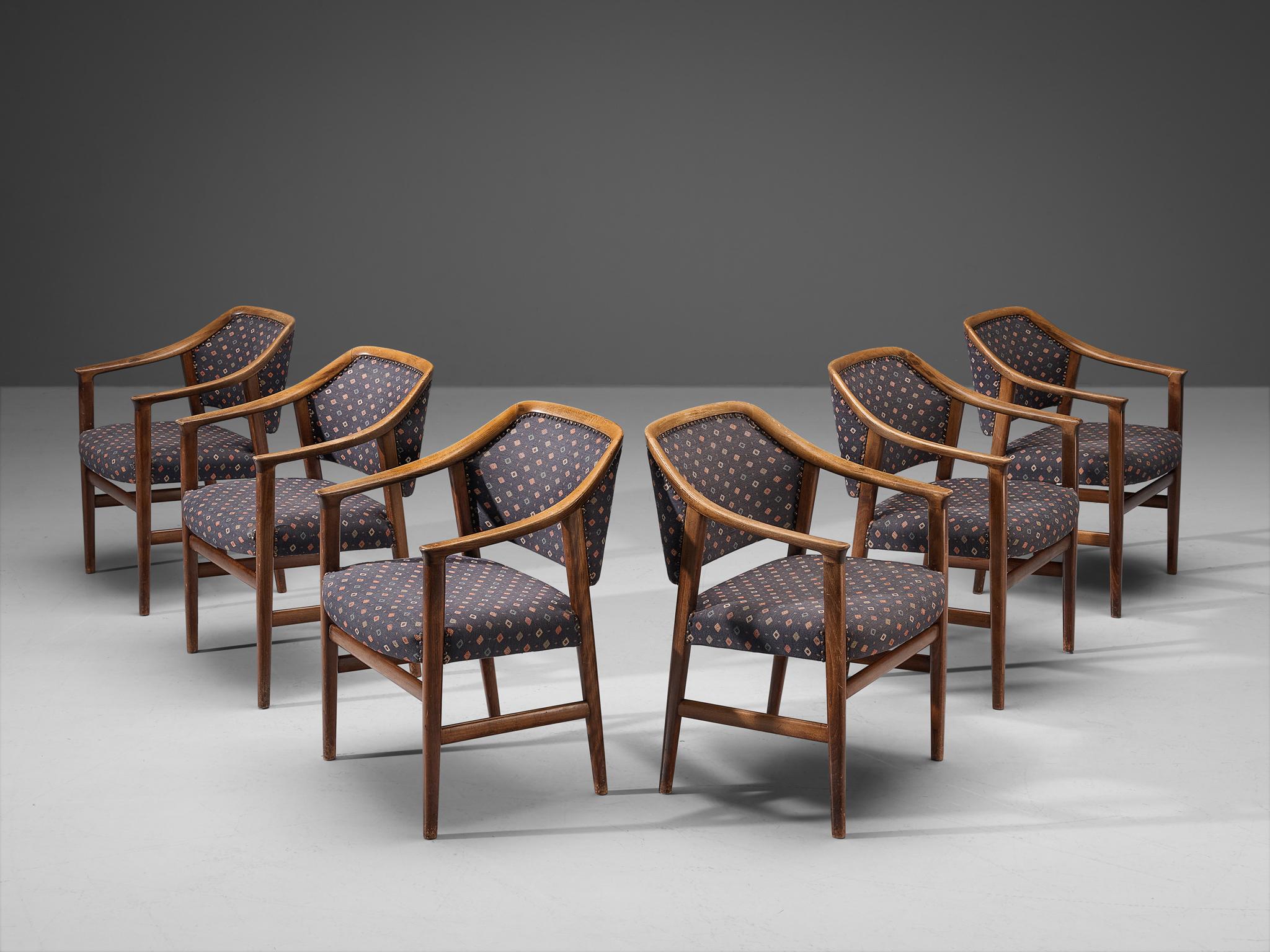 Set of six dining chairs, fabric, beech, metal, Italy 1960s

These beautifully constructed armchairs feature an open and clear patinated wooden frame based on simplistic forms. A nice detail is how the back elegantly runs over into the armrests,