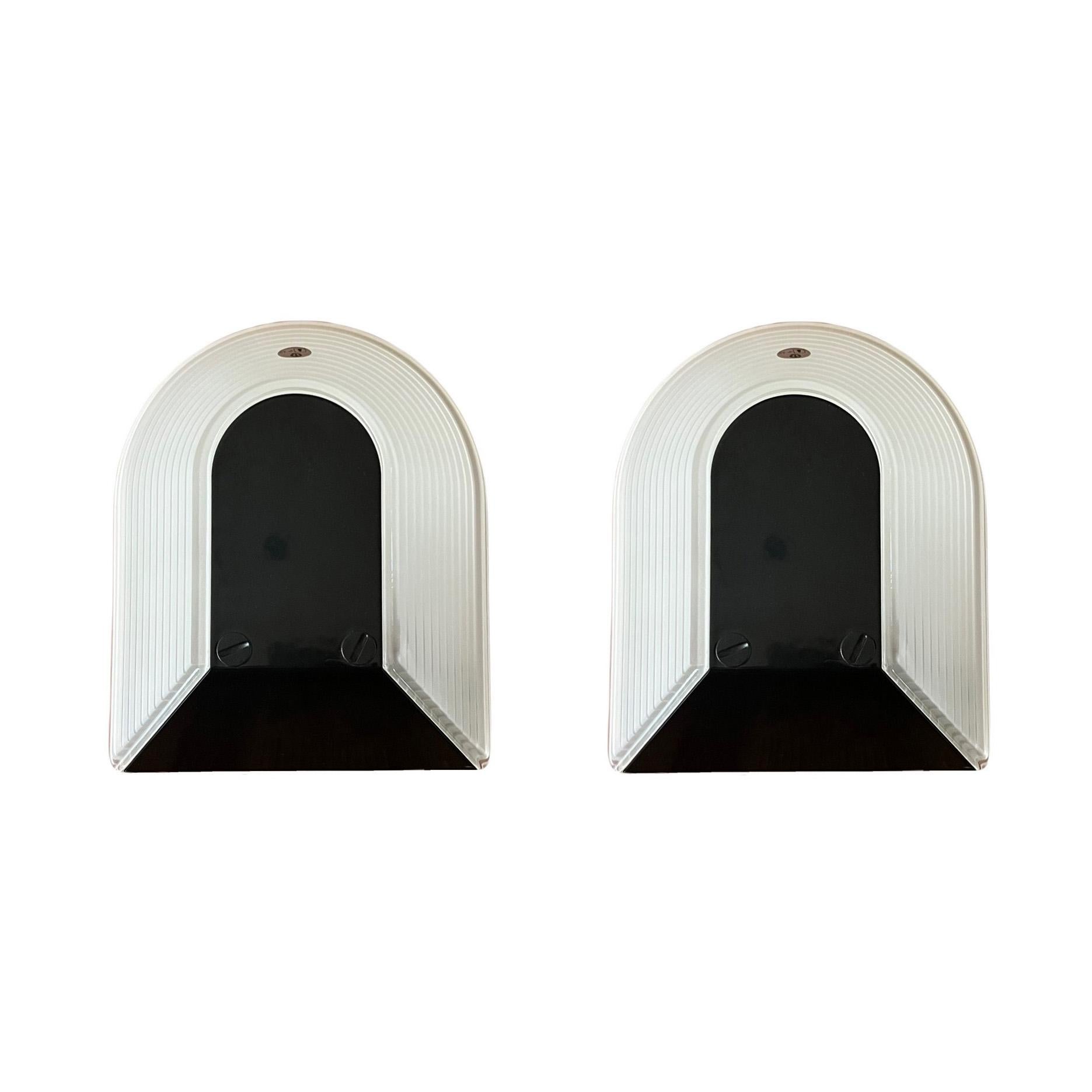 New old stock and Italian black St of three wall sconces by Roberto Fiorato. These fixtures were made during the 1980s in Italy for Prisma, model 