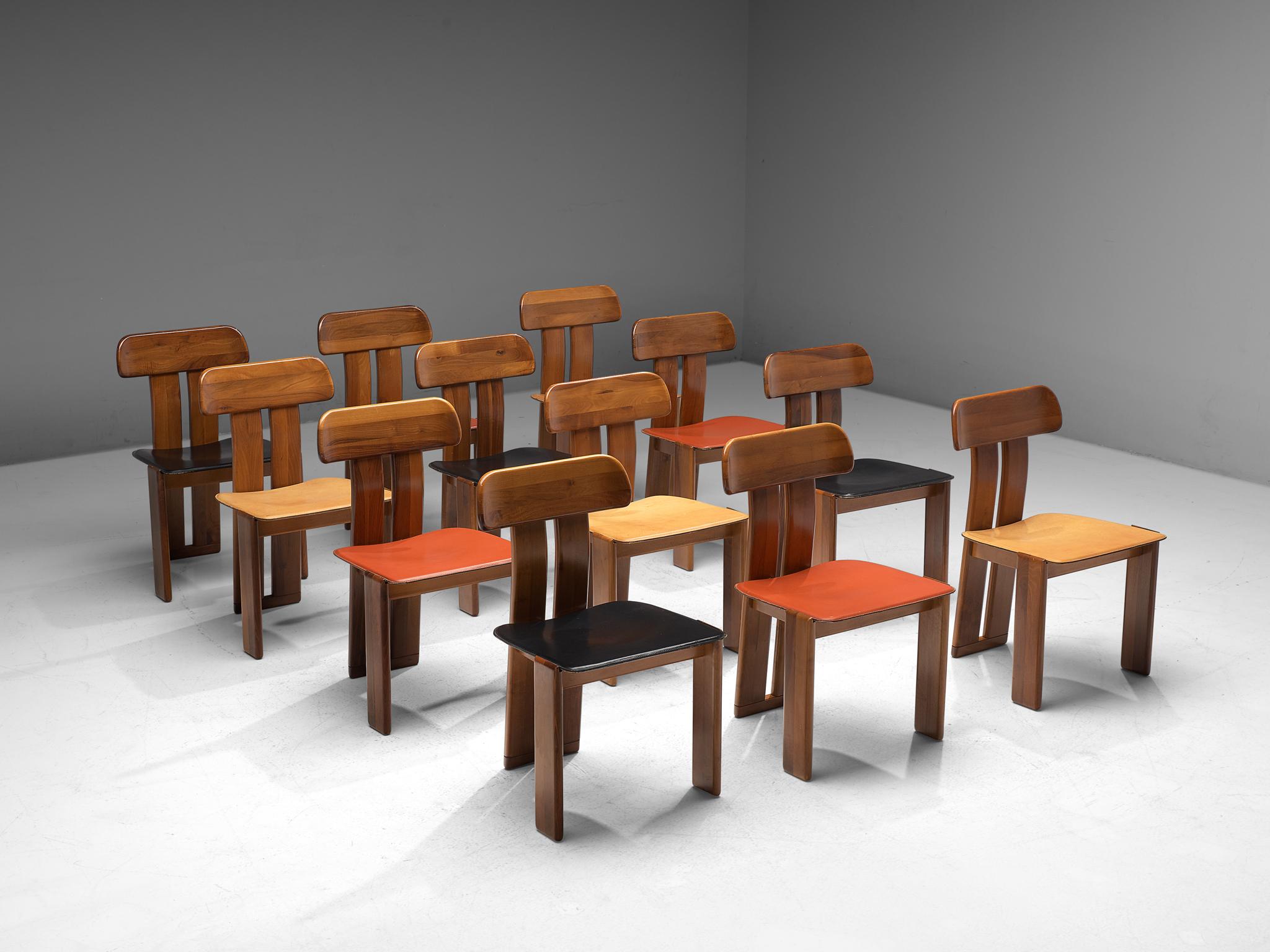 Sapporo for Mobil Girgi, 12 dining chairs, Italian walnut and leather in red, black and beige, Italy, 1970s.

Combined set of sculptural chairs that feature wonderful backrests, consisting of two vertical slats distanced from each other. At the