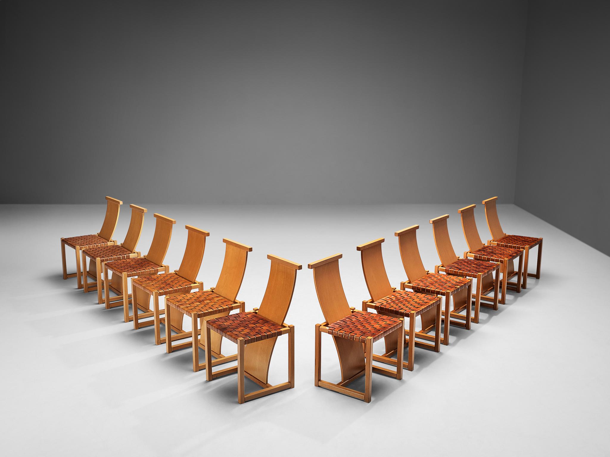 Set of twelve dining chairs, leather, beech, Italy, late 1970s

Stunning and large number set of twelve sculptural and impressive dining chairs. These chairs have a frame and long backrest in beech. The backs of these chairs are long and wavy and