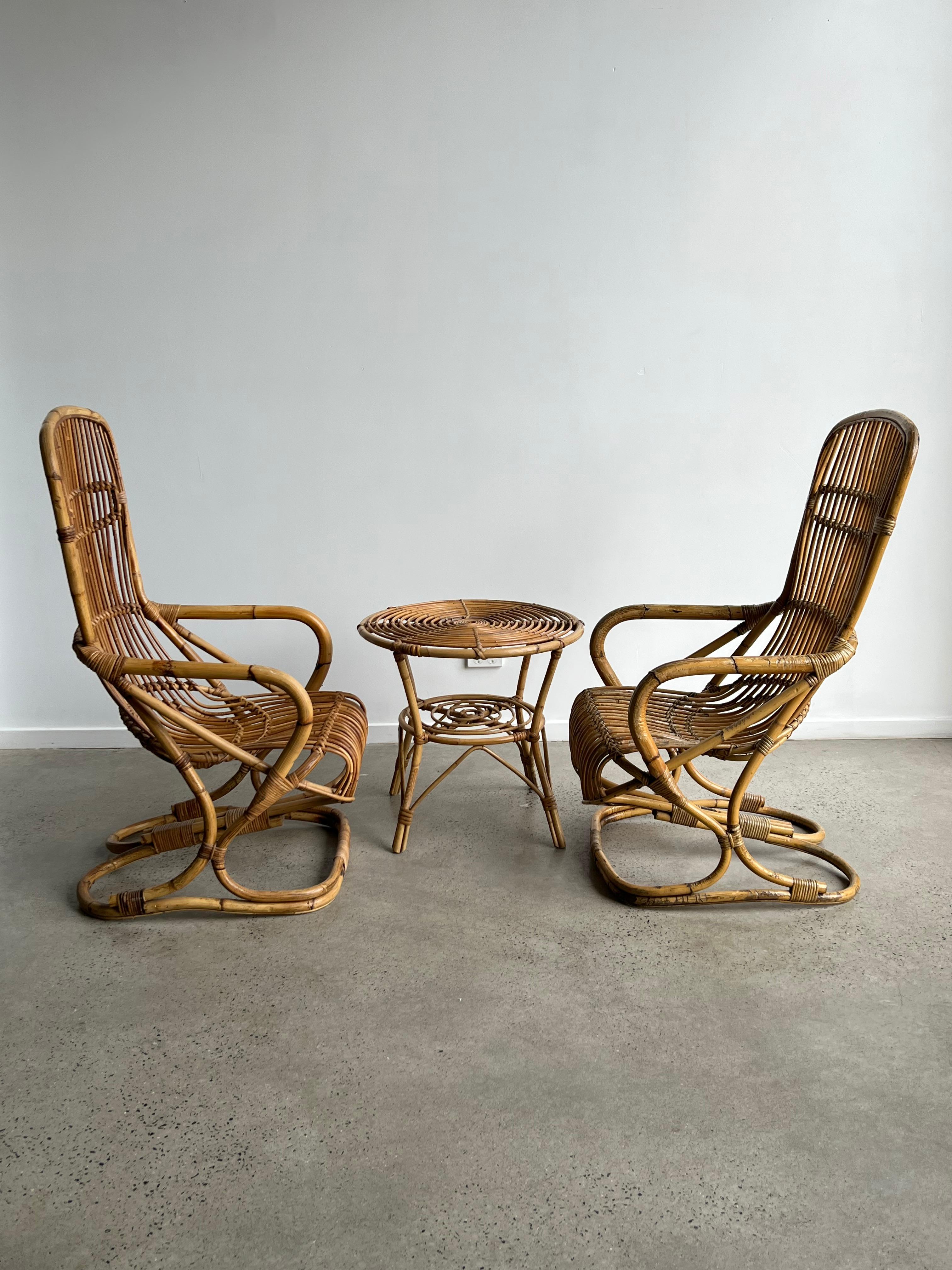 Stunning and in good condition set of two armchairs and one side table in Bamboo by Tito Agnoli 1960s.