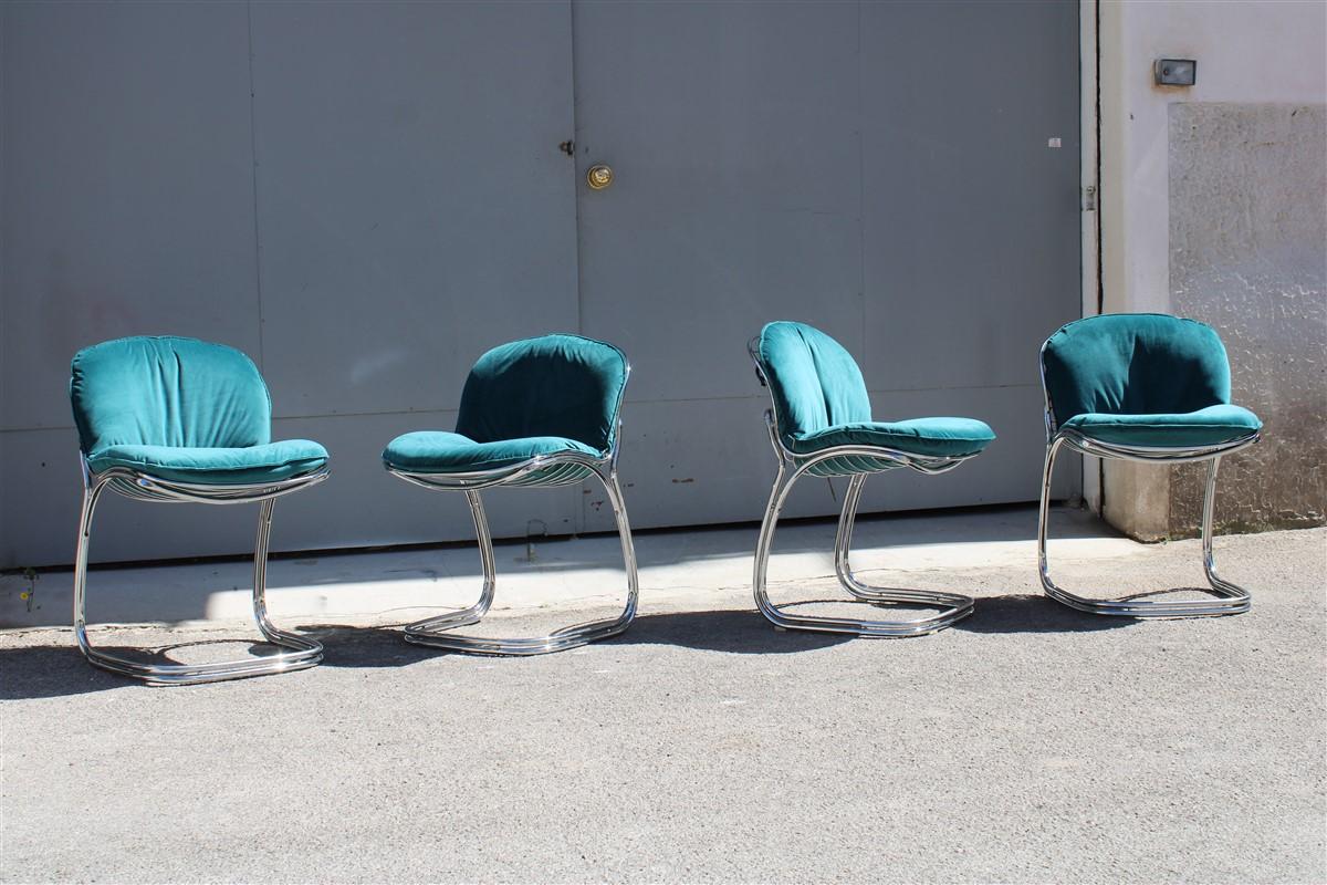 Set of 4 chromed metal chairs with green velvet cushions, some of the structures have restorations as shown in the photo.
