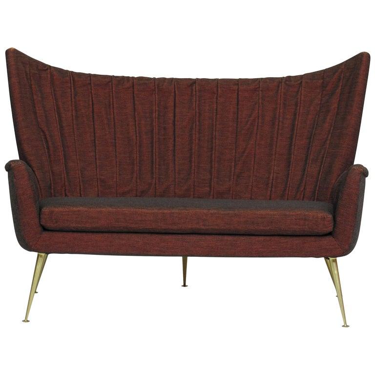 Matching three piece set includes:
 
1- 1950s Italian channel-back sofa covered in the original burgundy horsehair textile ($5500)

2- Pair of 1950s Italian channel-back lounge chairs in original olive green horsehair textile, hand sewn draped