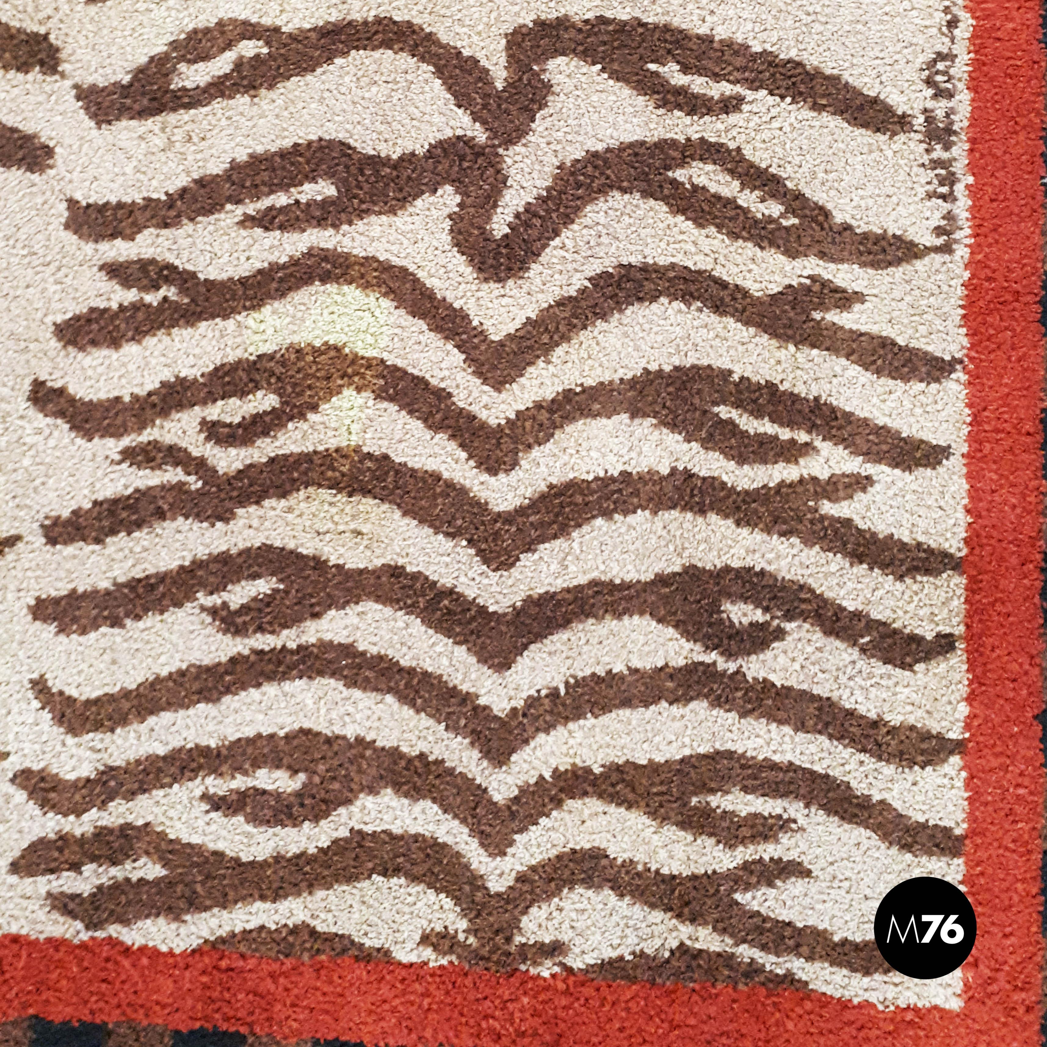Italian short pile Fendi carpet, 80s
Brown and beige zebra striped short pile carpet with red and black details from Fendi, 1980s.

On the corners there is the logo in red.

Good conditions, it has small cuts.

Measurements 239x165 cm.