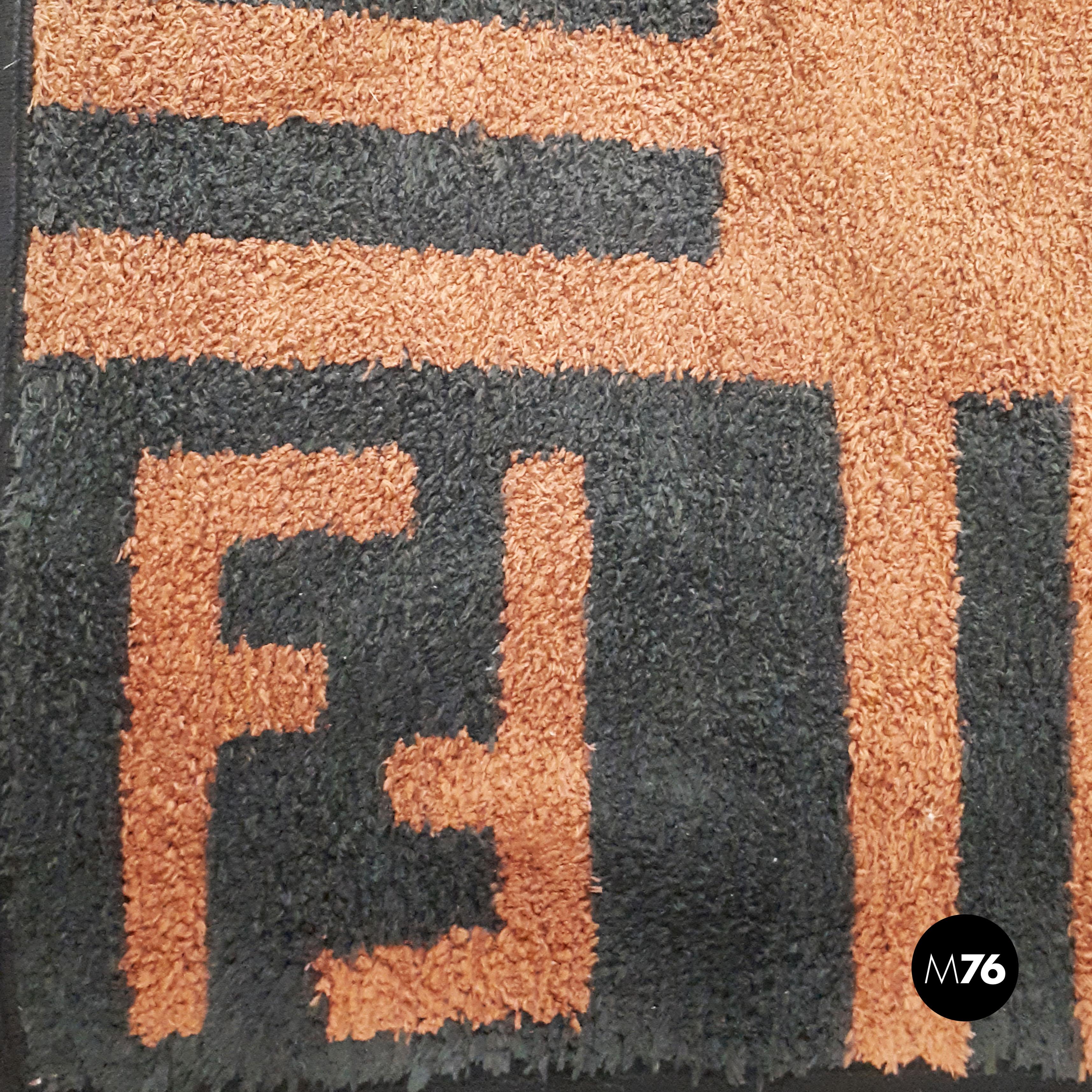 Italian short pile Fendi carpet, 80s.
Brown short pile rug with dark green details from Fendi, 1980s.
On the corners there is the logo in dark green.

Perfect conditions.

Measurements 238 x 179 cm.