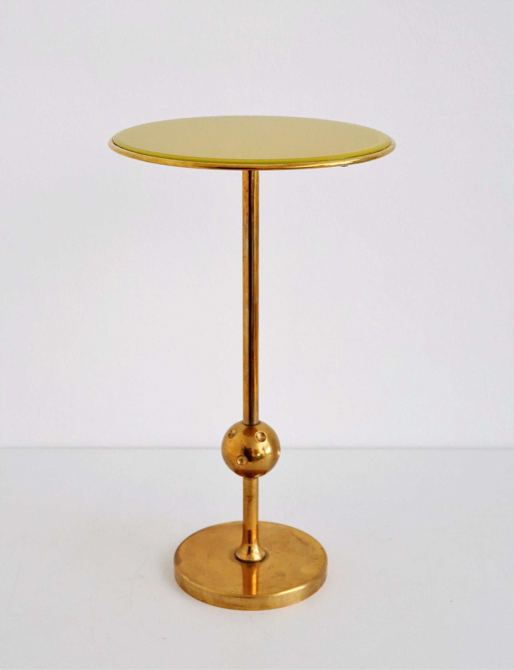 Beautiful iconic and rare side table made in full brass and mirrored glass top.
Designed in the 1940s by Osvaldo Borsani and produced in his own company in Northern Italy, Varedo.
These brass tables have never been produced in mass production but