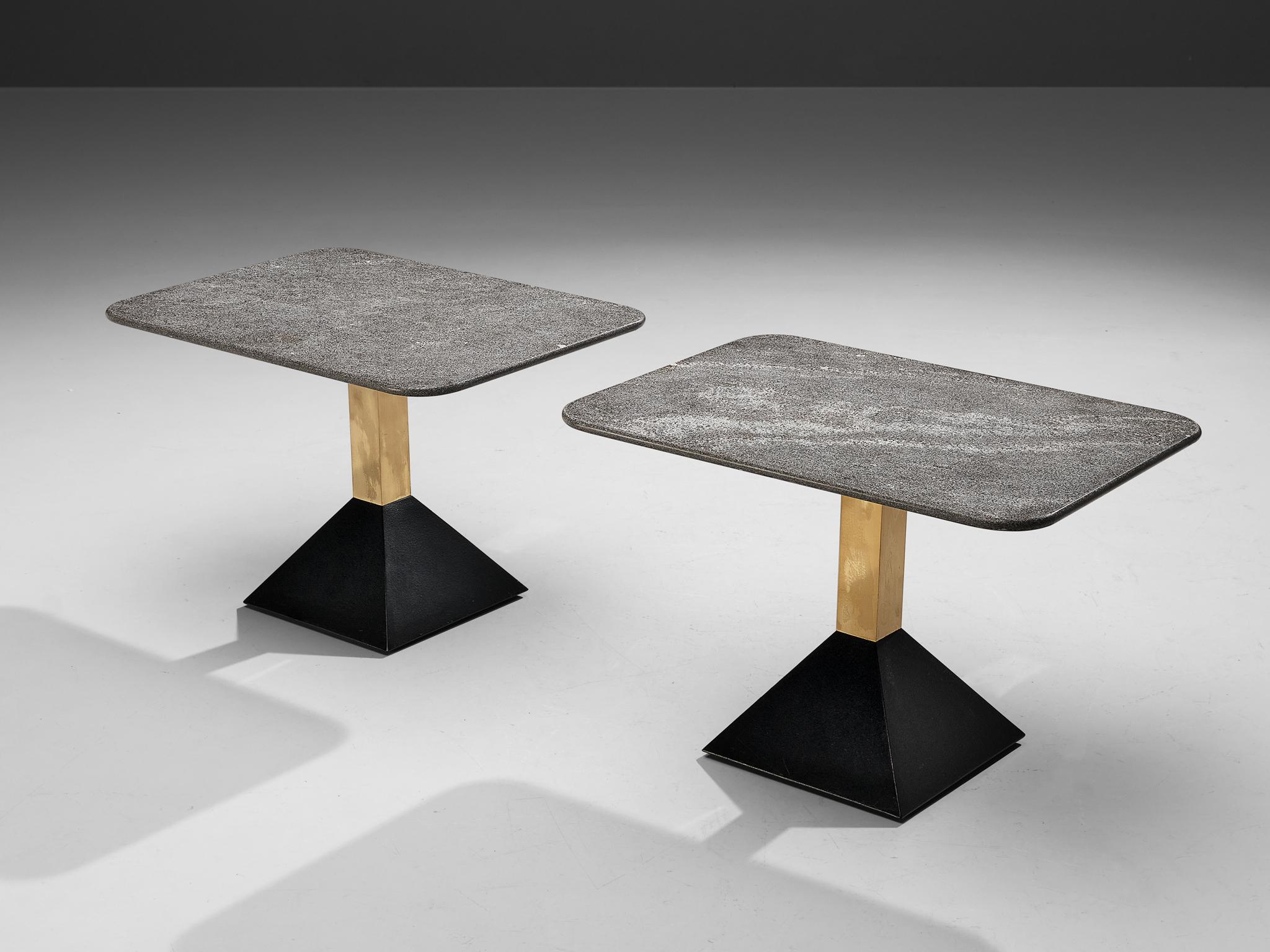 Side tables, granite, metal, brass, Italy, 1980s

These side tables feature a grey or red/brown tabletop in round or rectangular format. The granite shows a vivid surface. A brass pedestal ends in a black trapezoid base in black metal. The