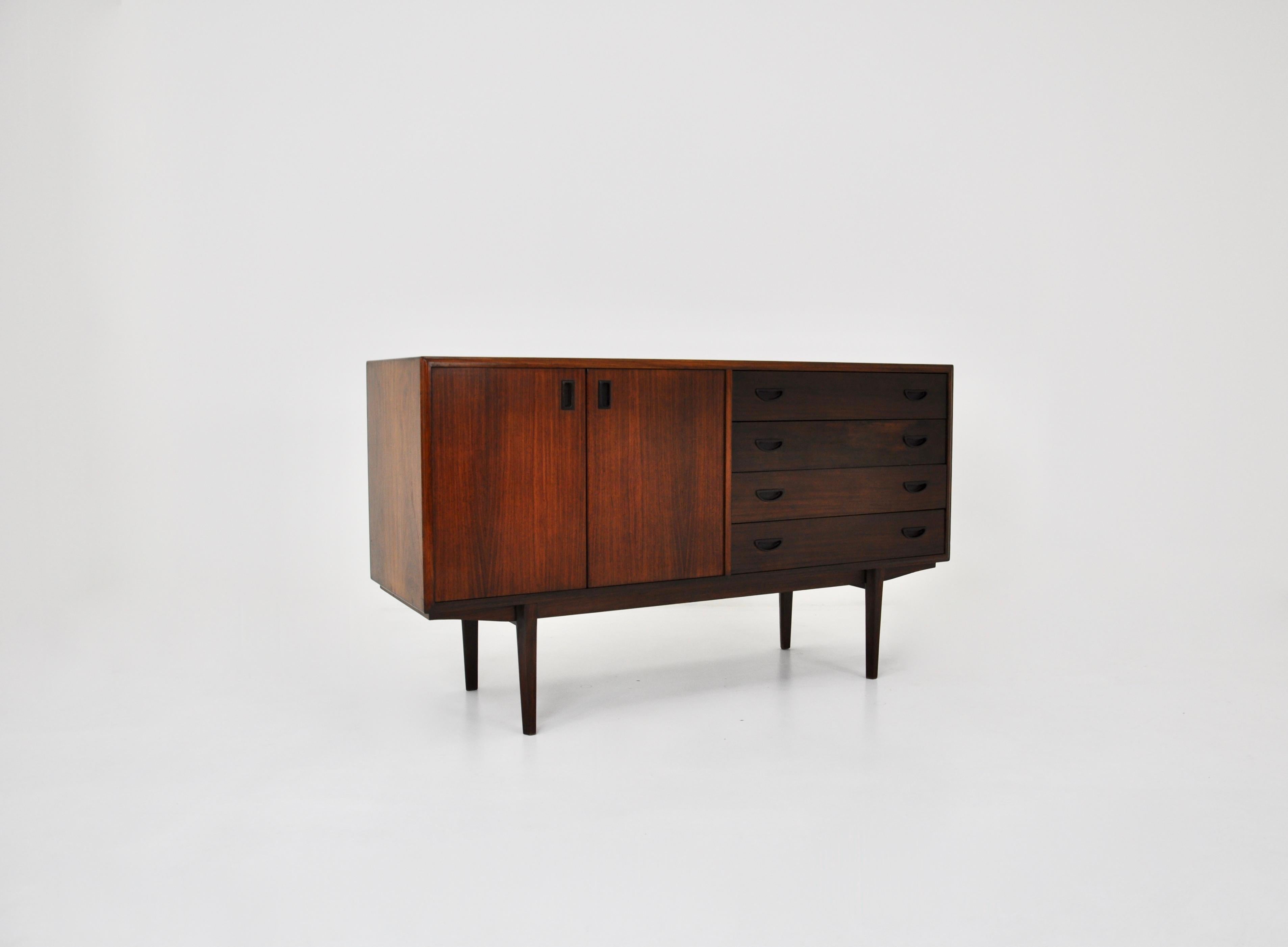 Italian wooden sideboard. It has 4 drawers and a double door with a shelf. Wear due to time and age of the sideboard.