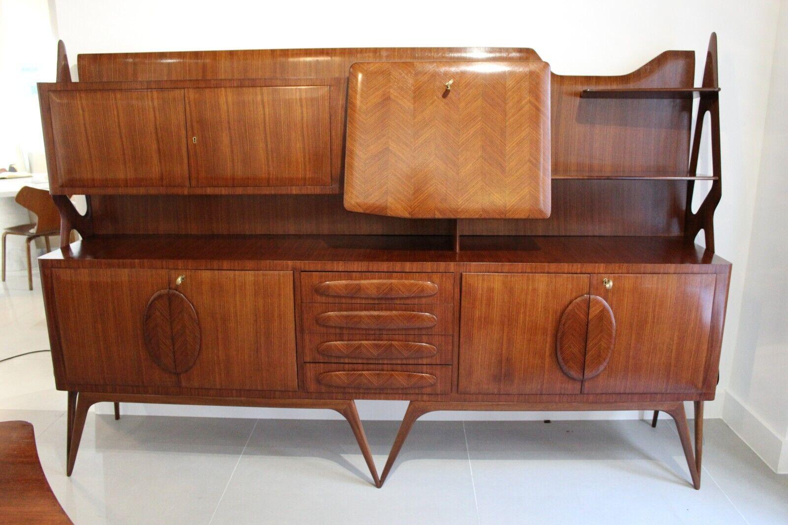 A very rare and superb example of a sideboard by Iconic Italian designer Ico Parisi, 1950's. 

This piece made from walnut has exceptional detailed cross banding inlay. 

Sculptural legs and frame, the body of the sideboard has lots of storage